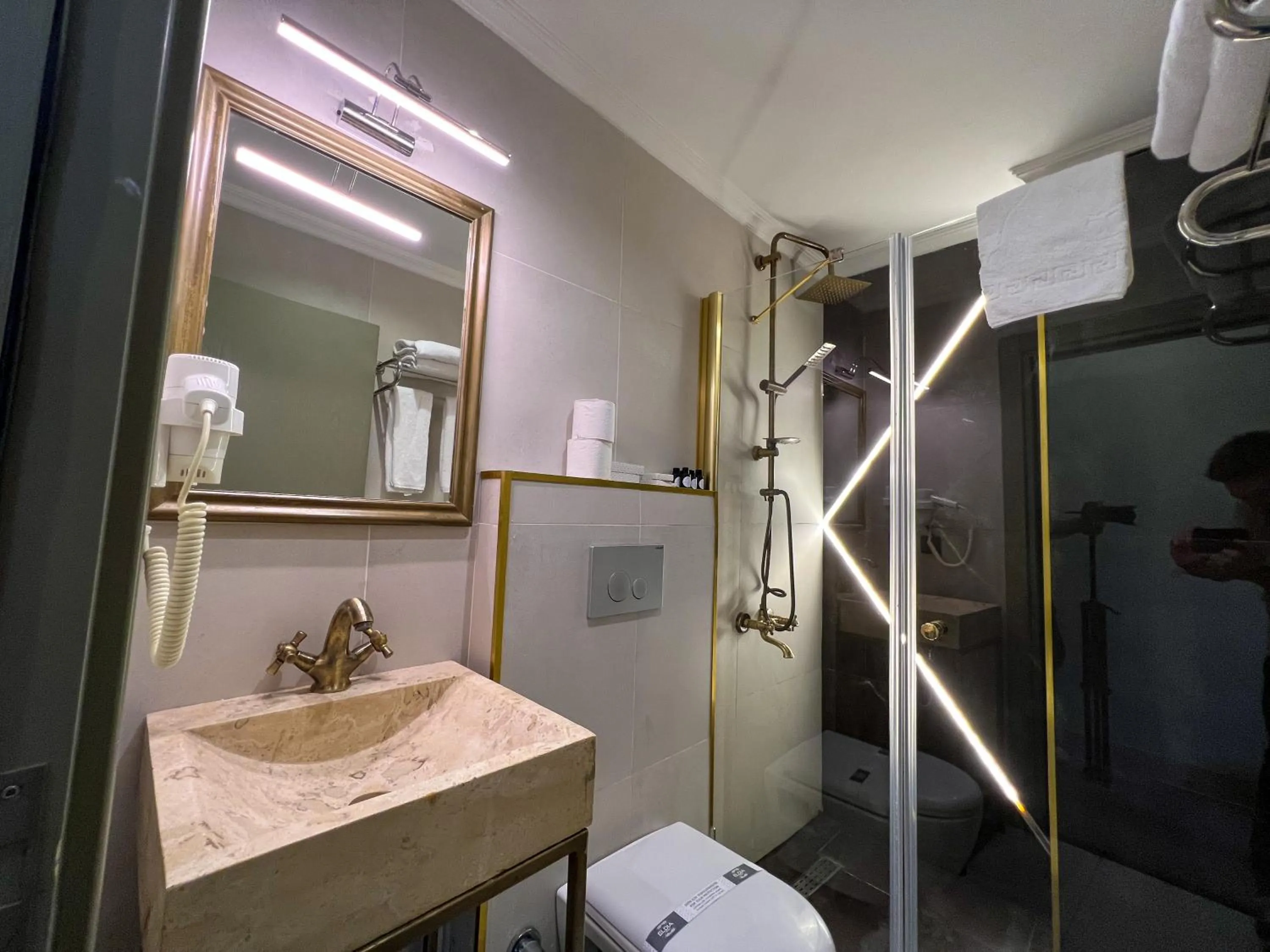 Shower in By Kinyas Hotel