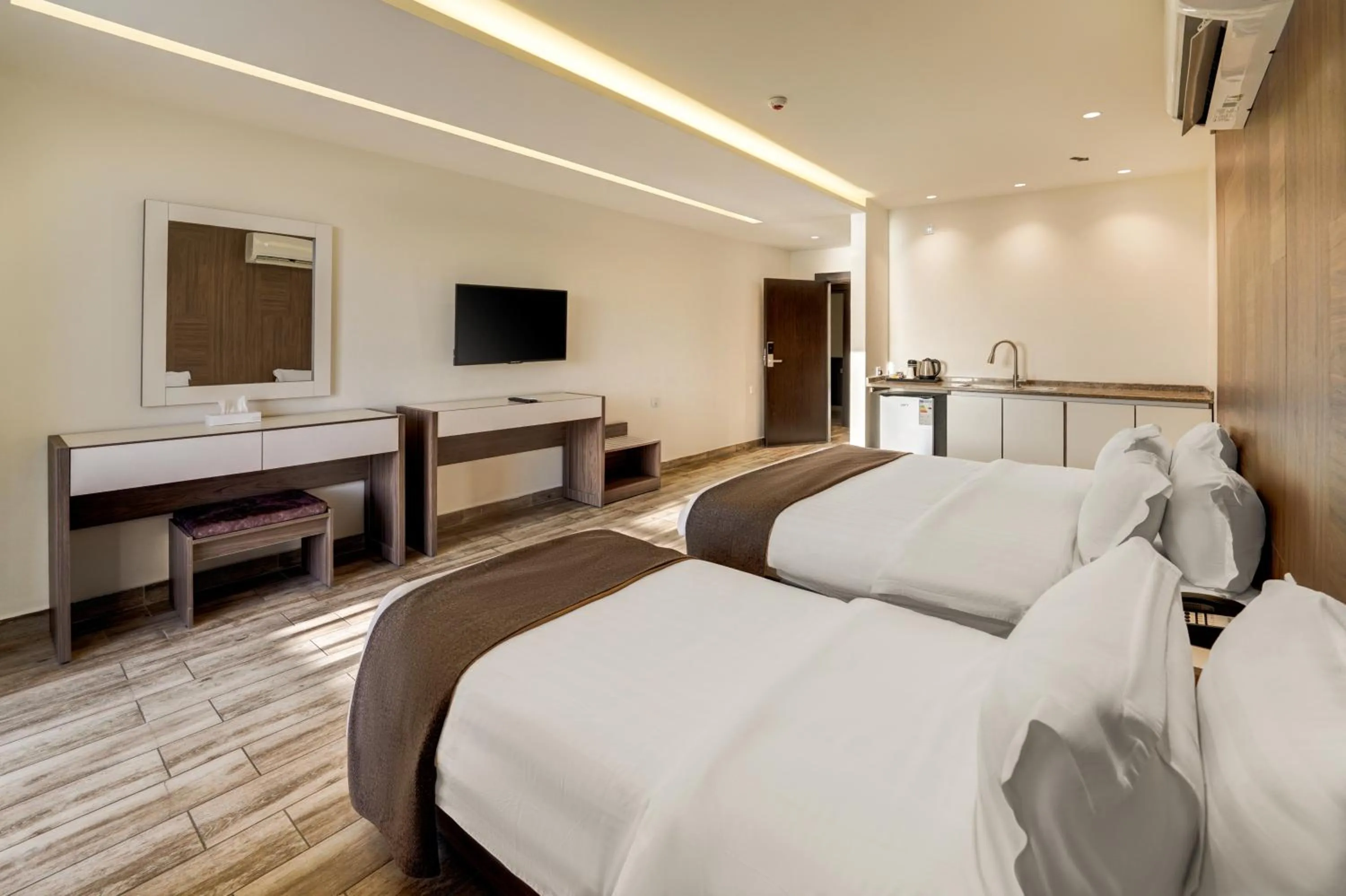 Communal lounge/ TV room, Bed in Luciana Hotel by FHM