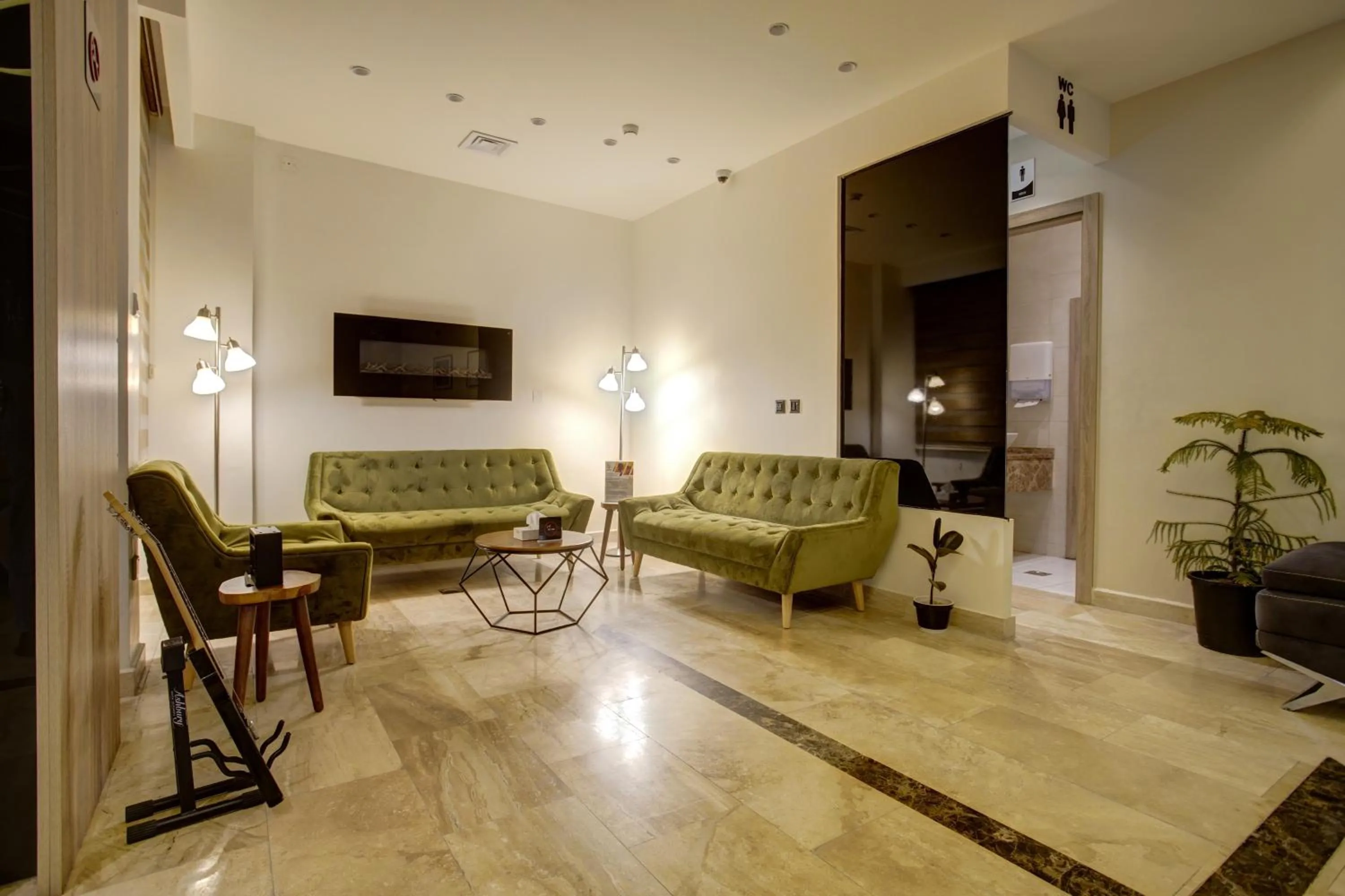 Seating area in Luciana Hotel by FHM