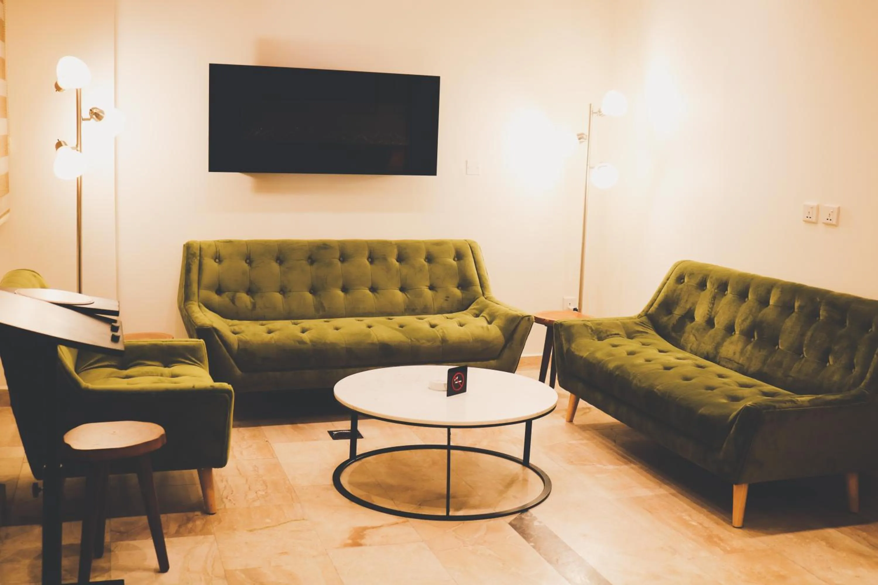 Communal lounge/ TV room in Luciana Hotel by FHM