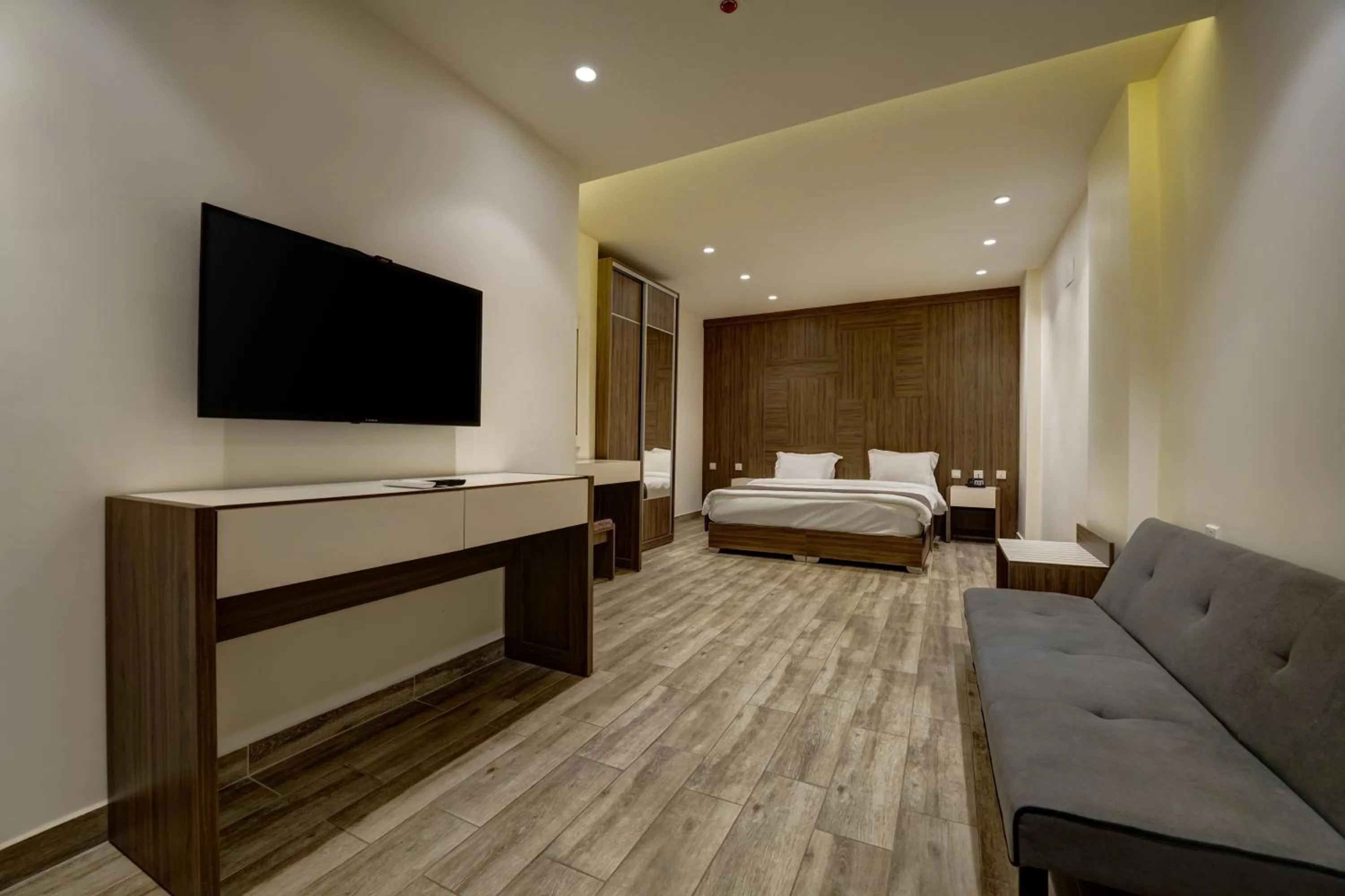Communal lounge/ TV room, Bed in Luciana Hotel by FHM