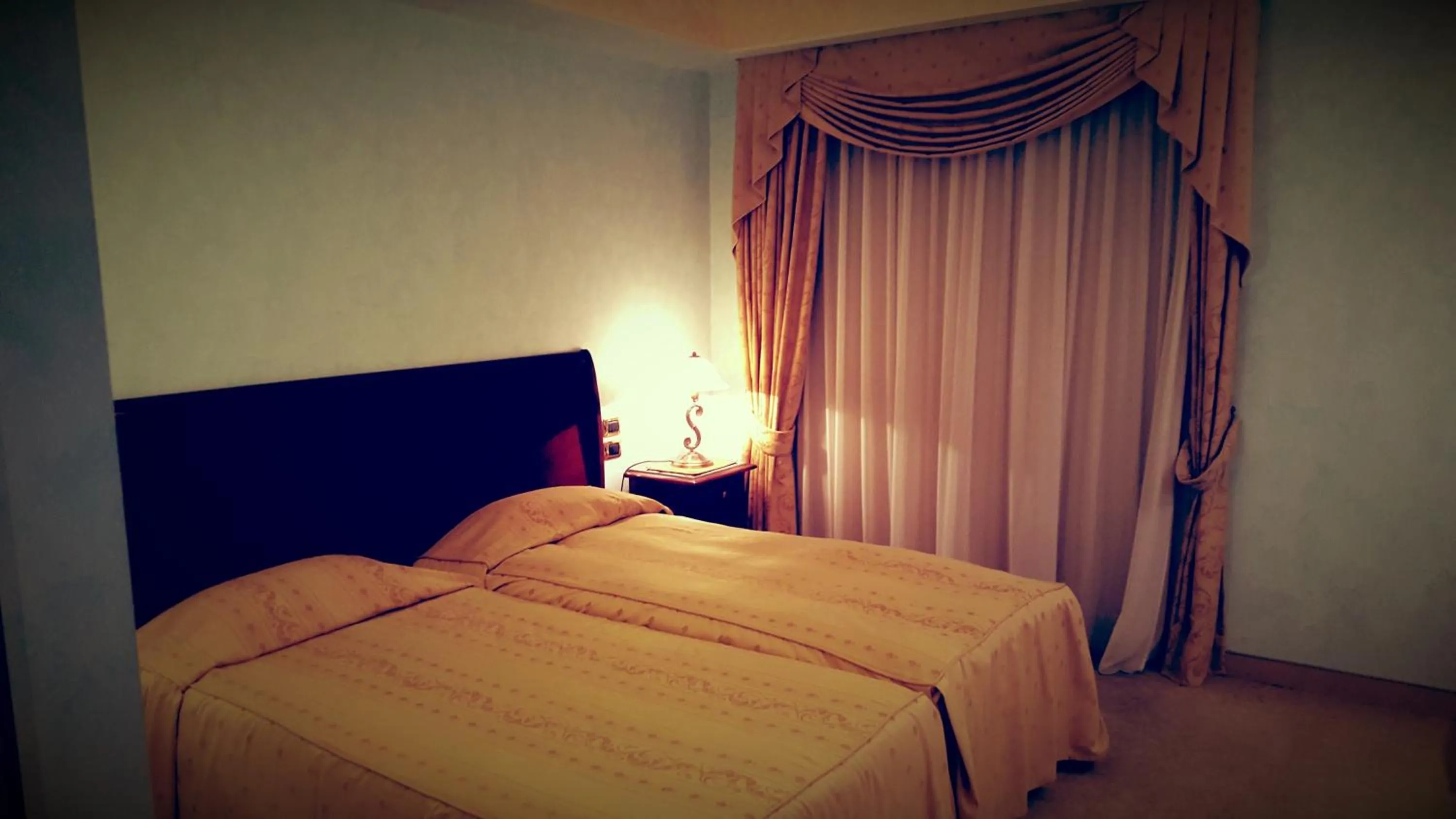 Bed in Gardenia Hotel