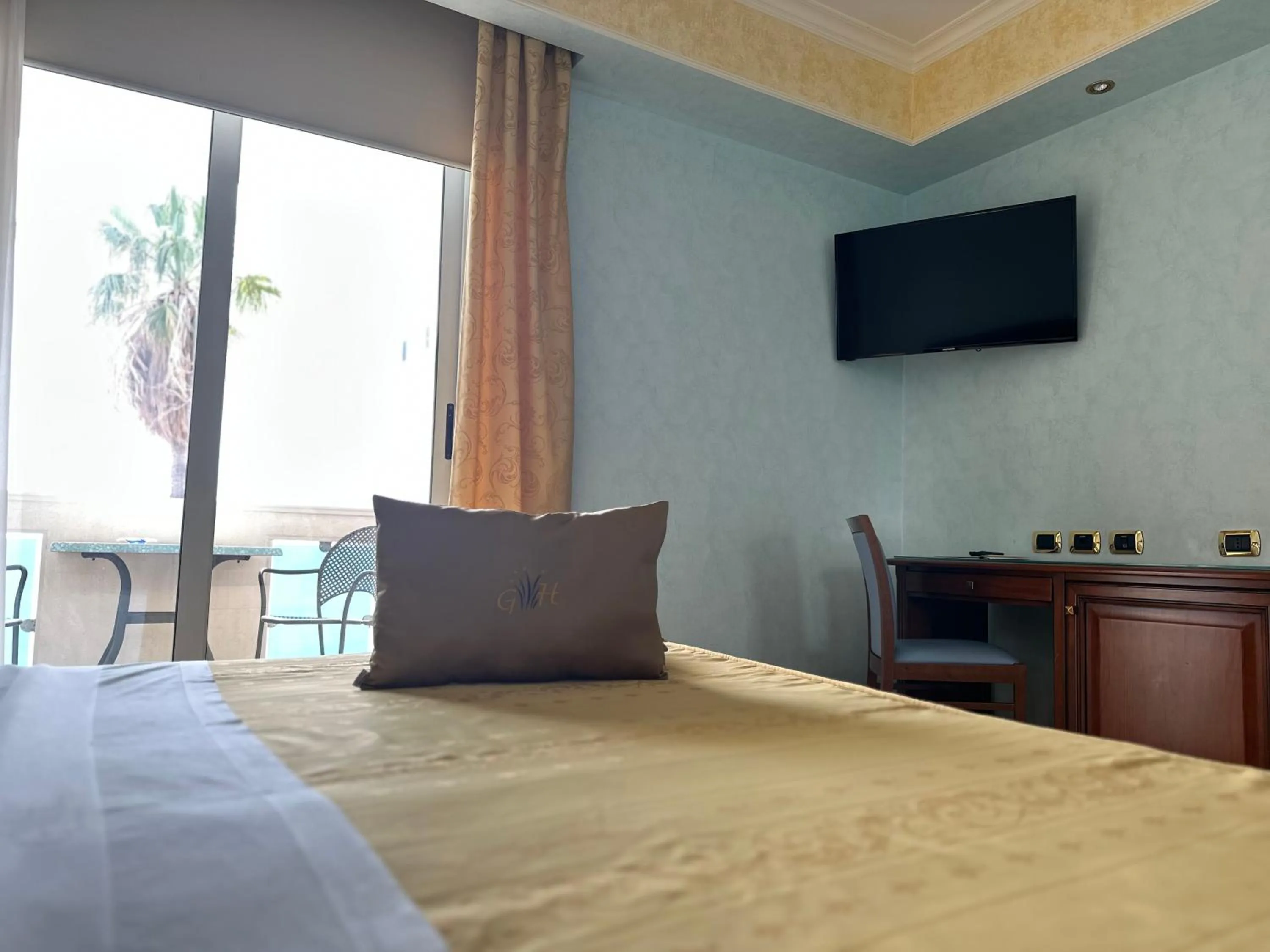 Bed in Gardenia Hotel