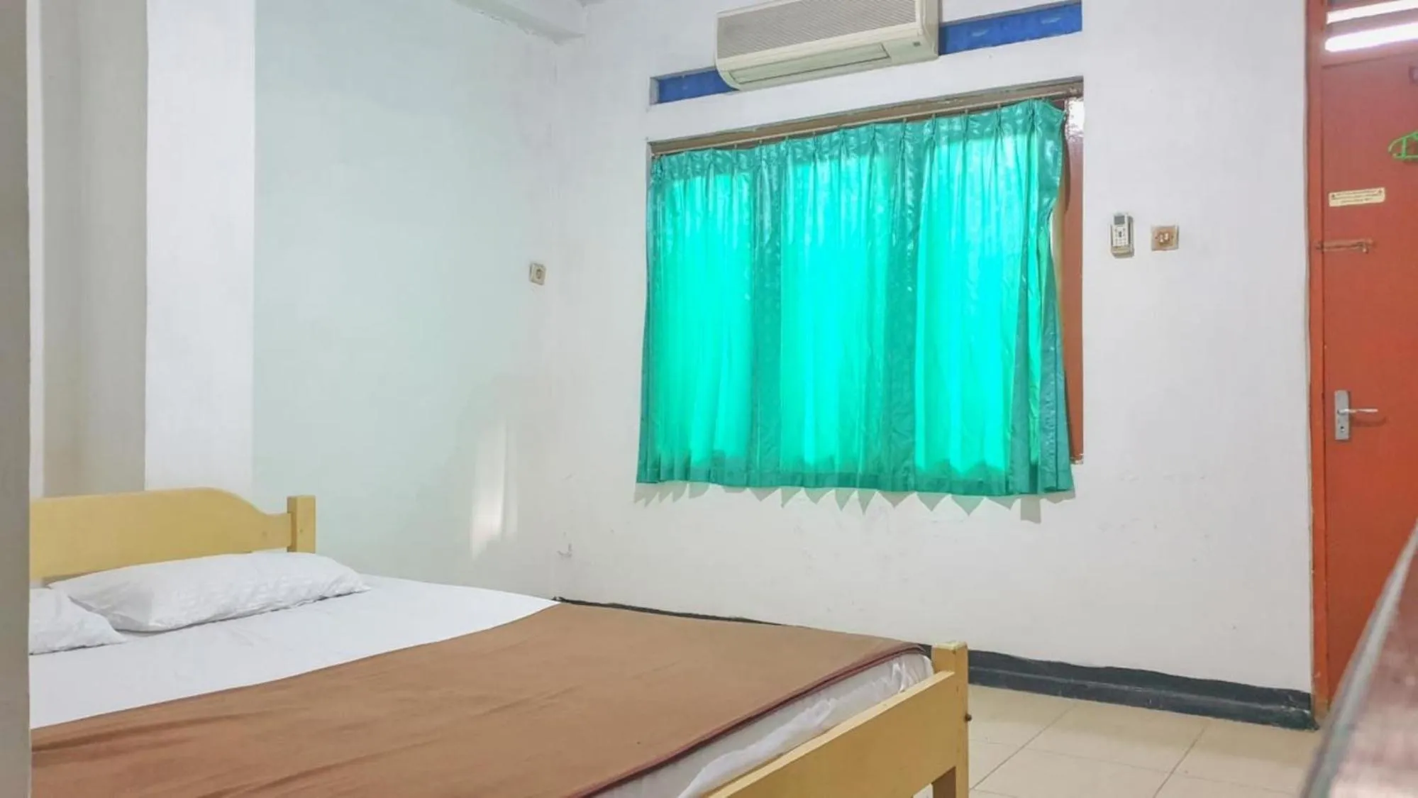 Bedroom, Bed in Hotel Jaya Kusuma near Candi Prambanan Mitra RedDoorz