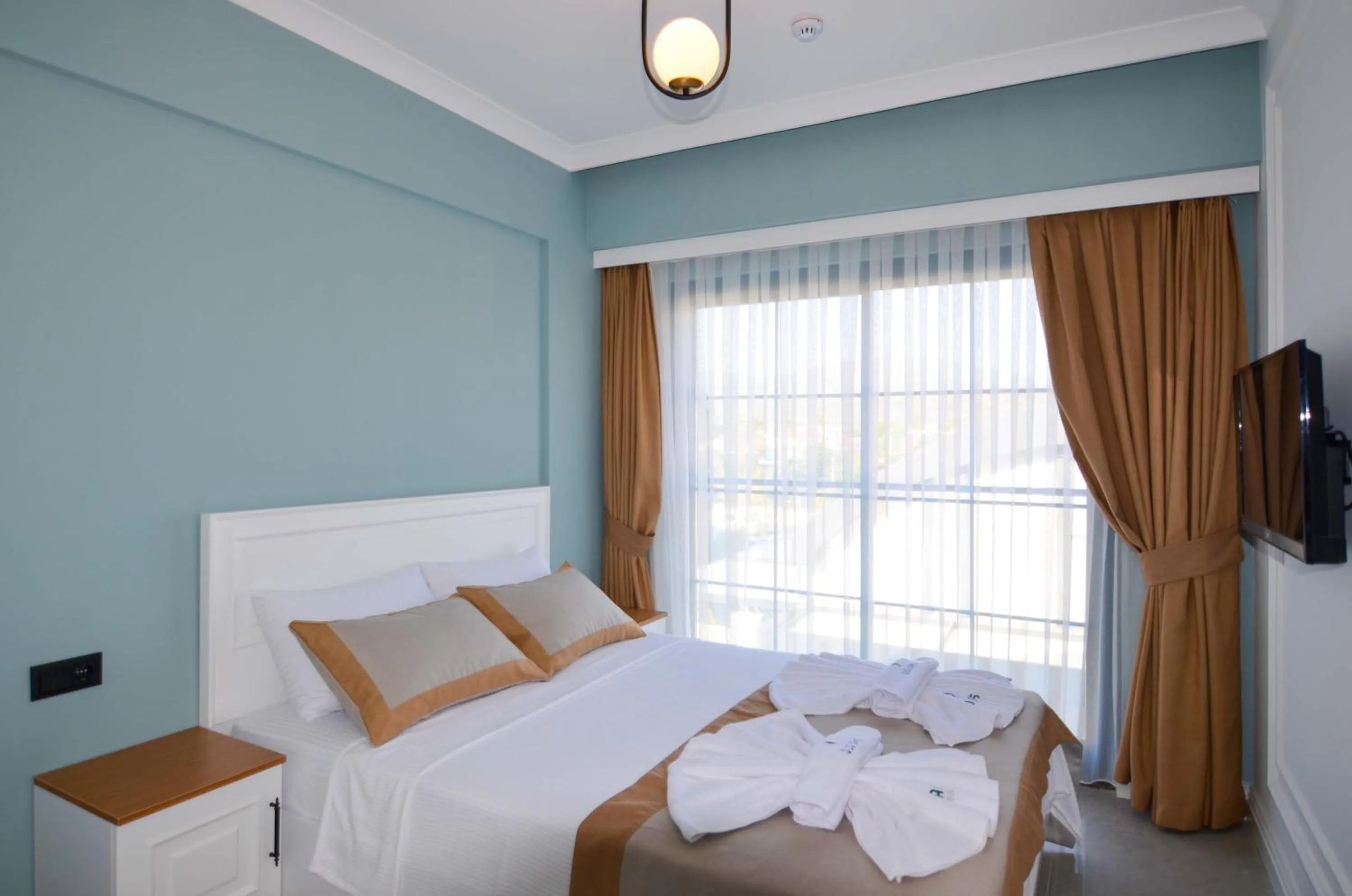 Bed in Juglans Suites