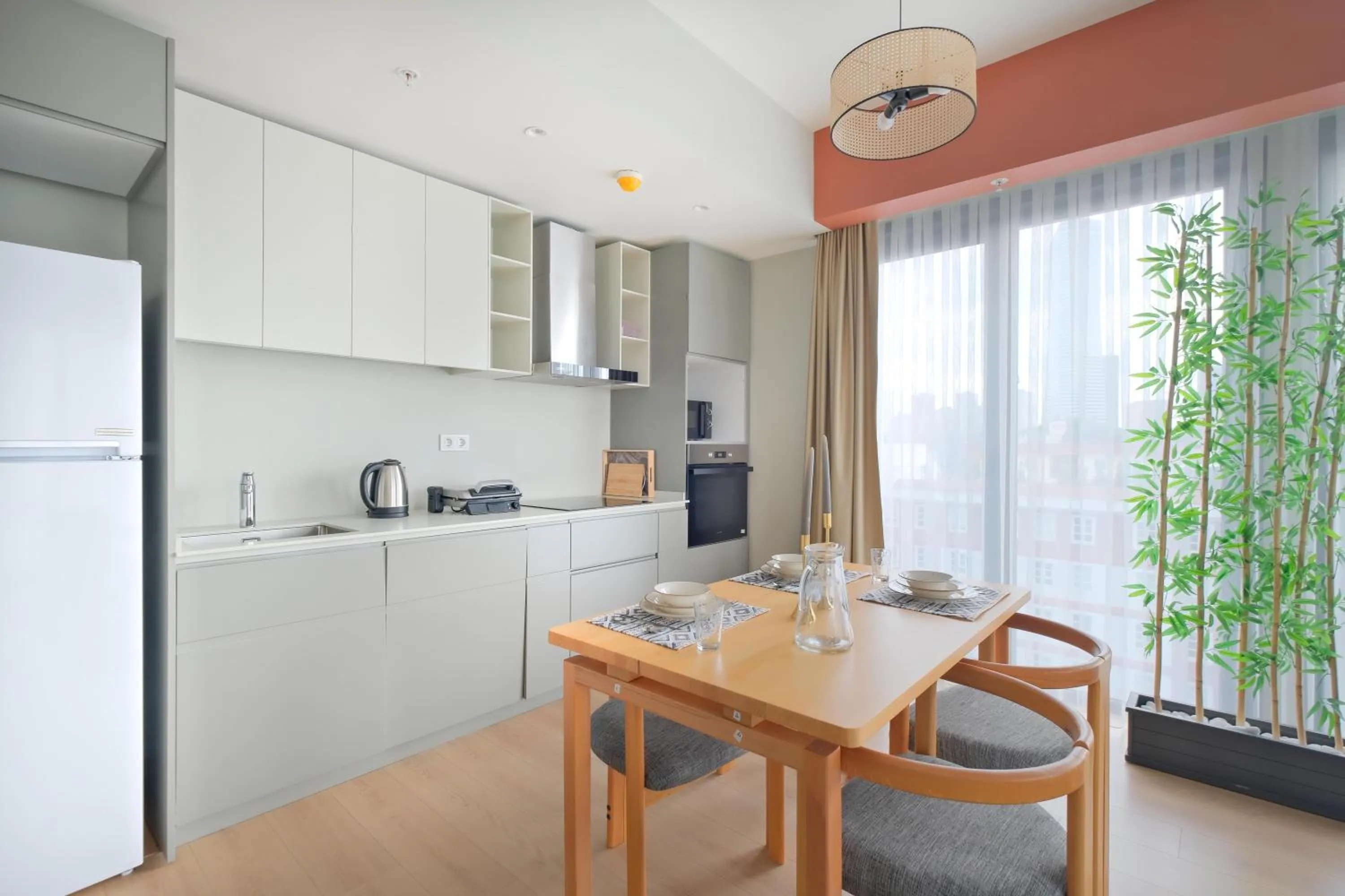 kitchen in Roya Nova Residence by NewInn