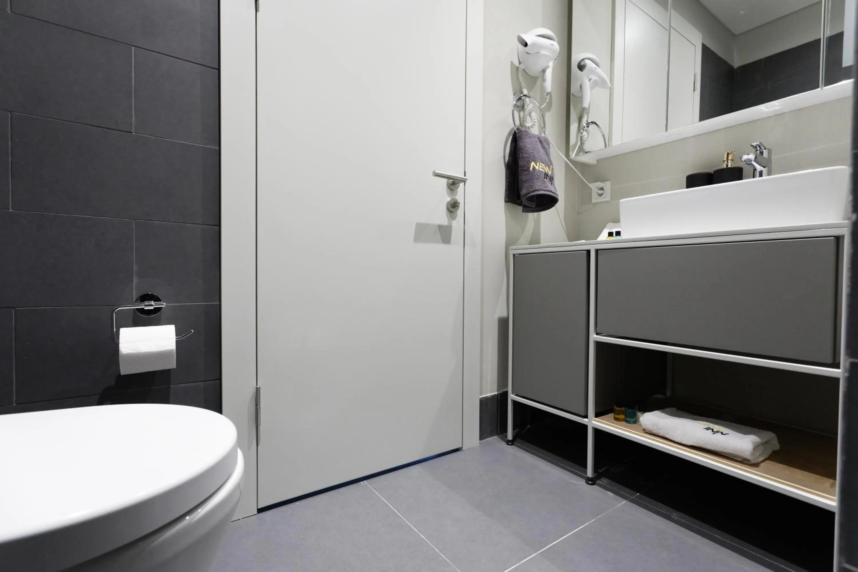 Shower in Roya Nova Residence by NewInn