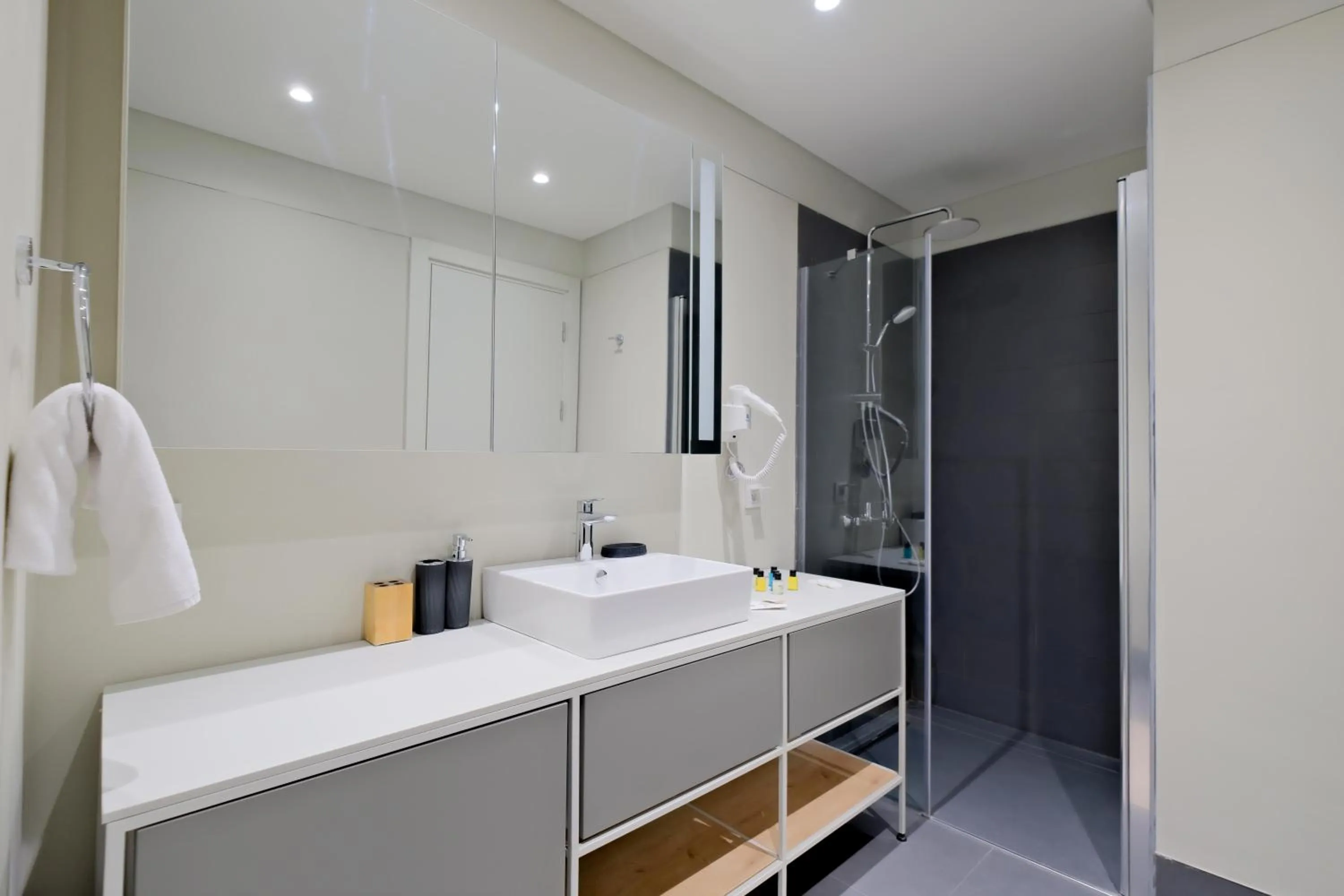 Bathroom in Roya Nova Residence by NewInn