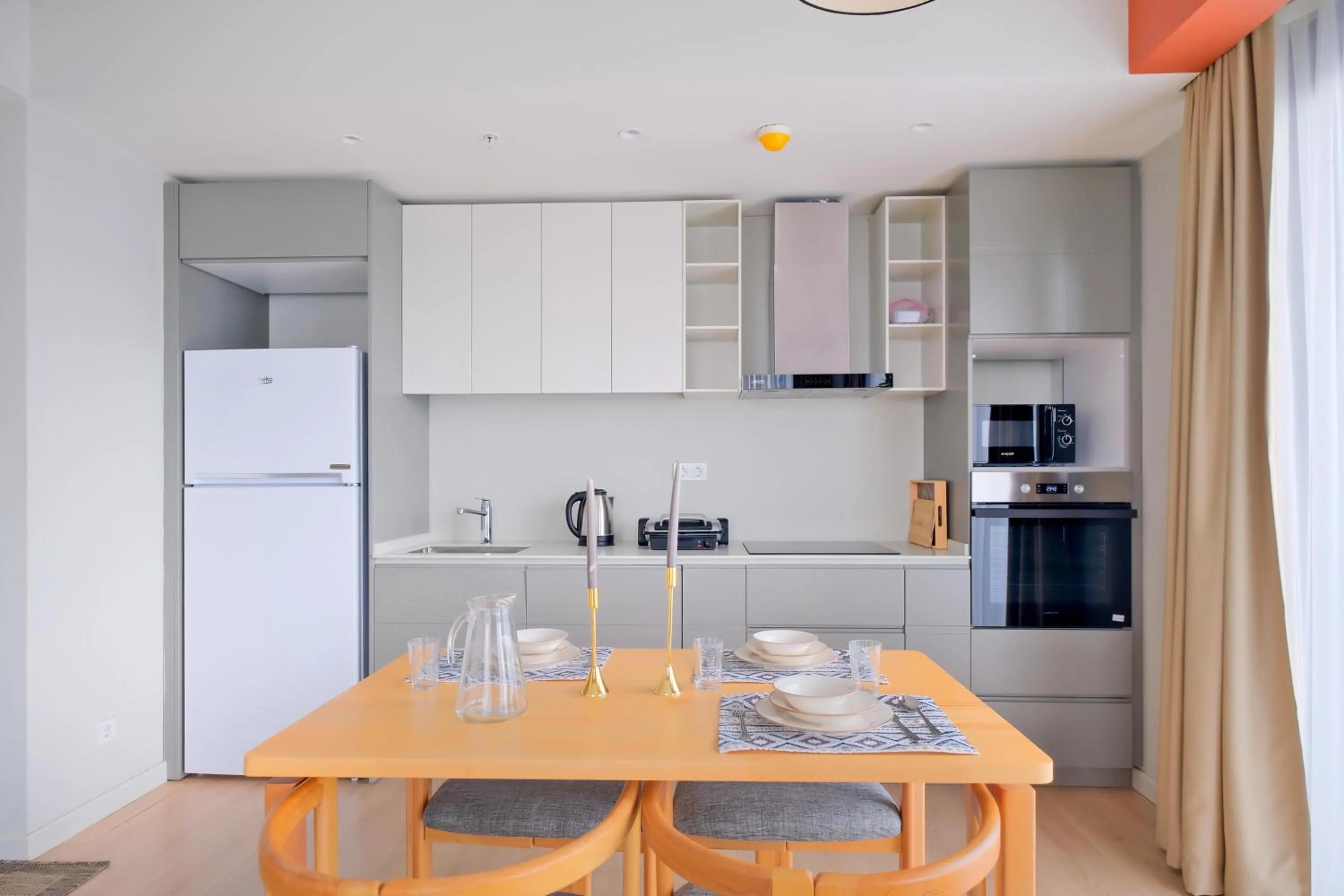 kitchen in Roya Nova Residence by NewInn