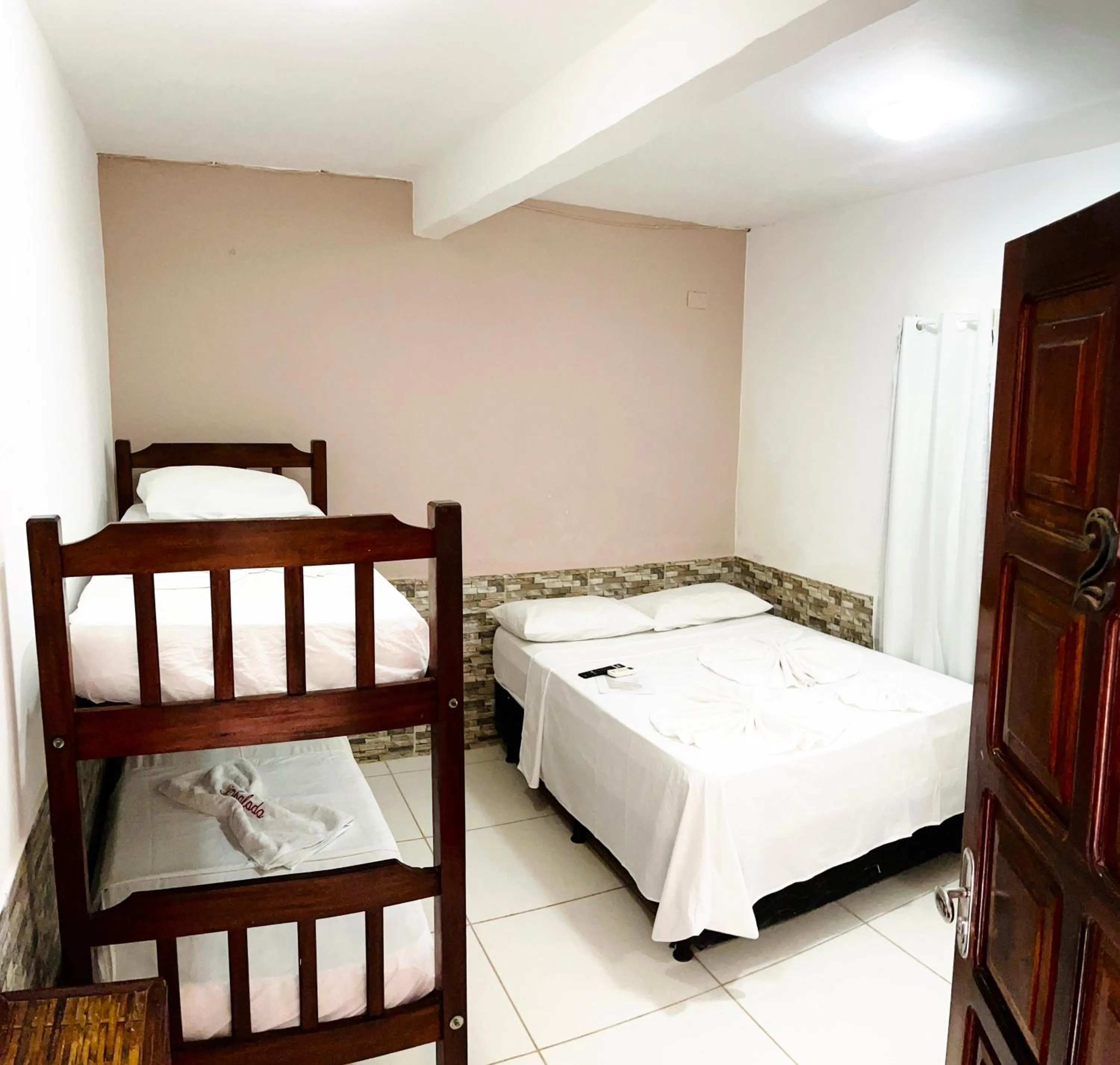 Photo of the whole room, Bed in Pousada Timbalada