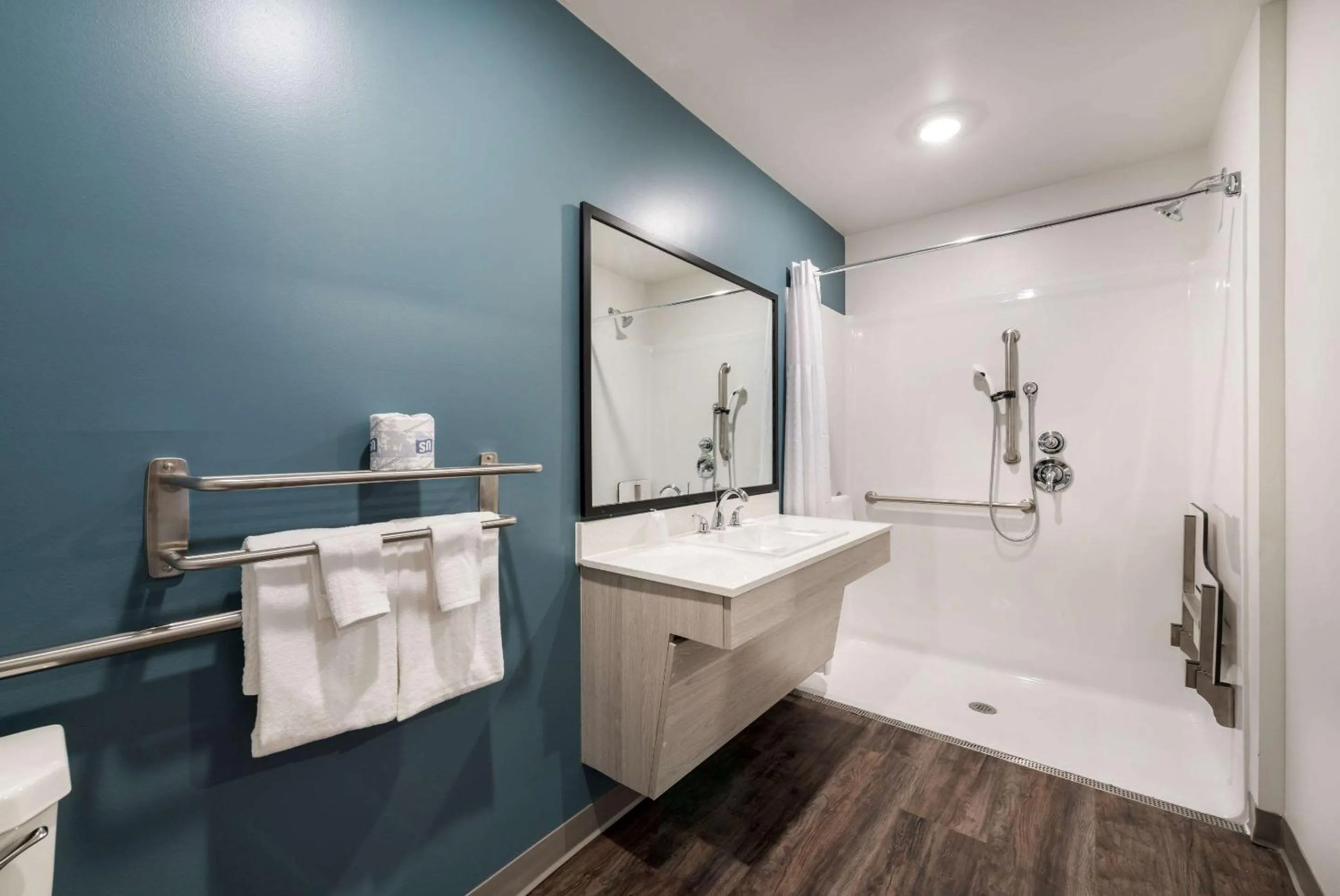 Bathroom in WoodSpring Suites Greensboro - High Point North