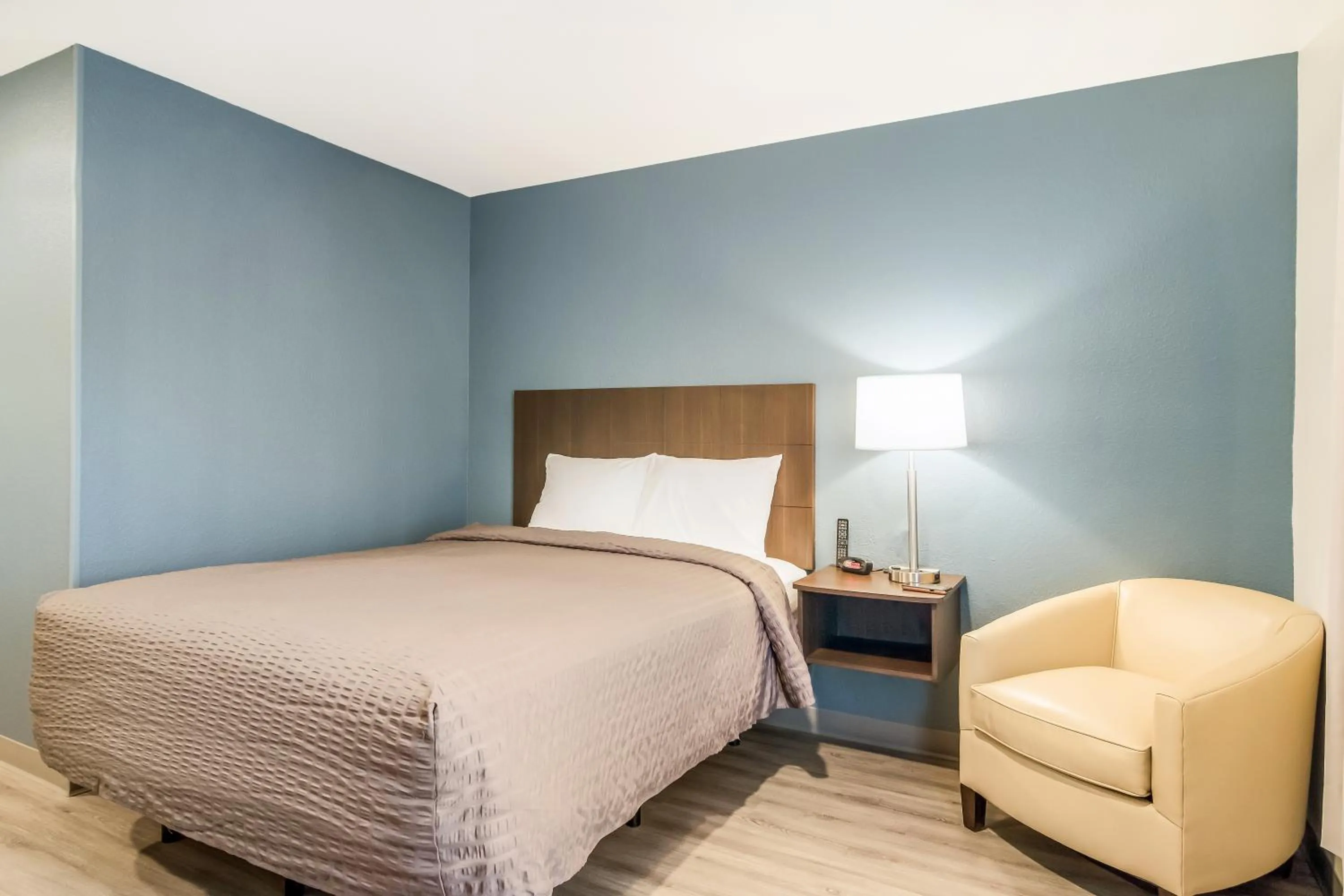 Bed in WoodSpring Suites Greensboro - High Point North