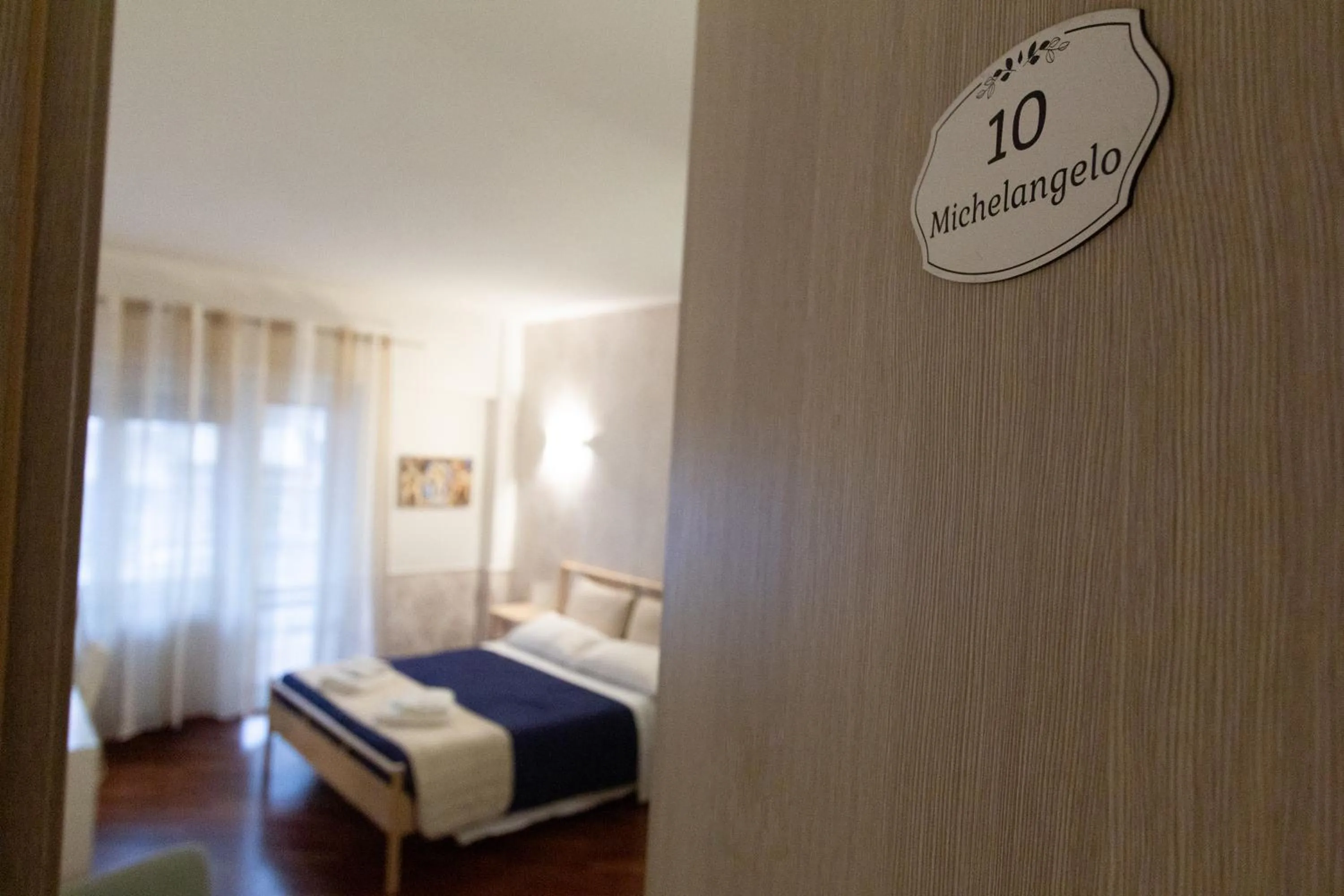 Decorative detail, Bed in Aurelio Deluxe Rooms