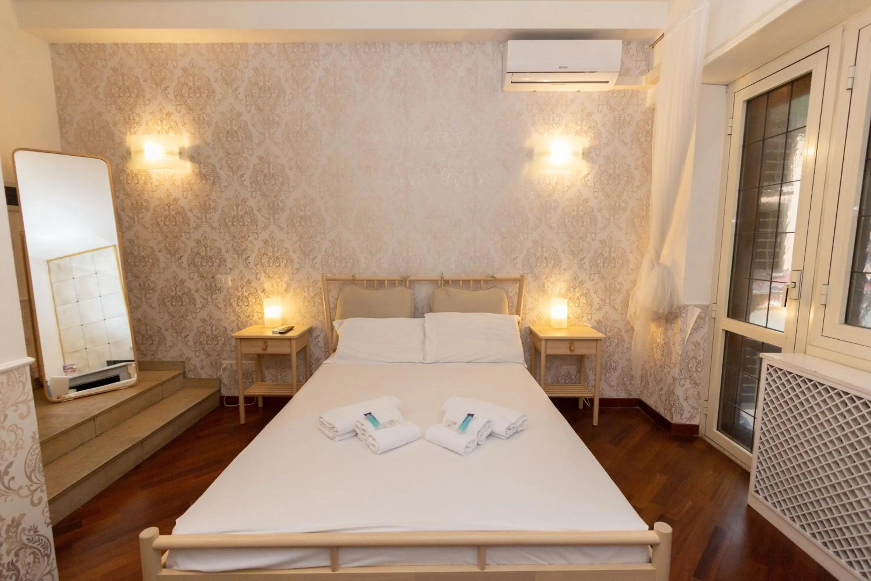 Bed in Aurelio Deluxe Rooms