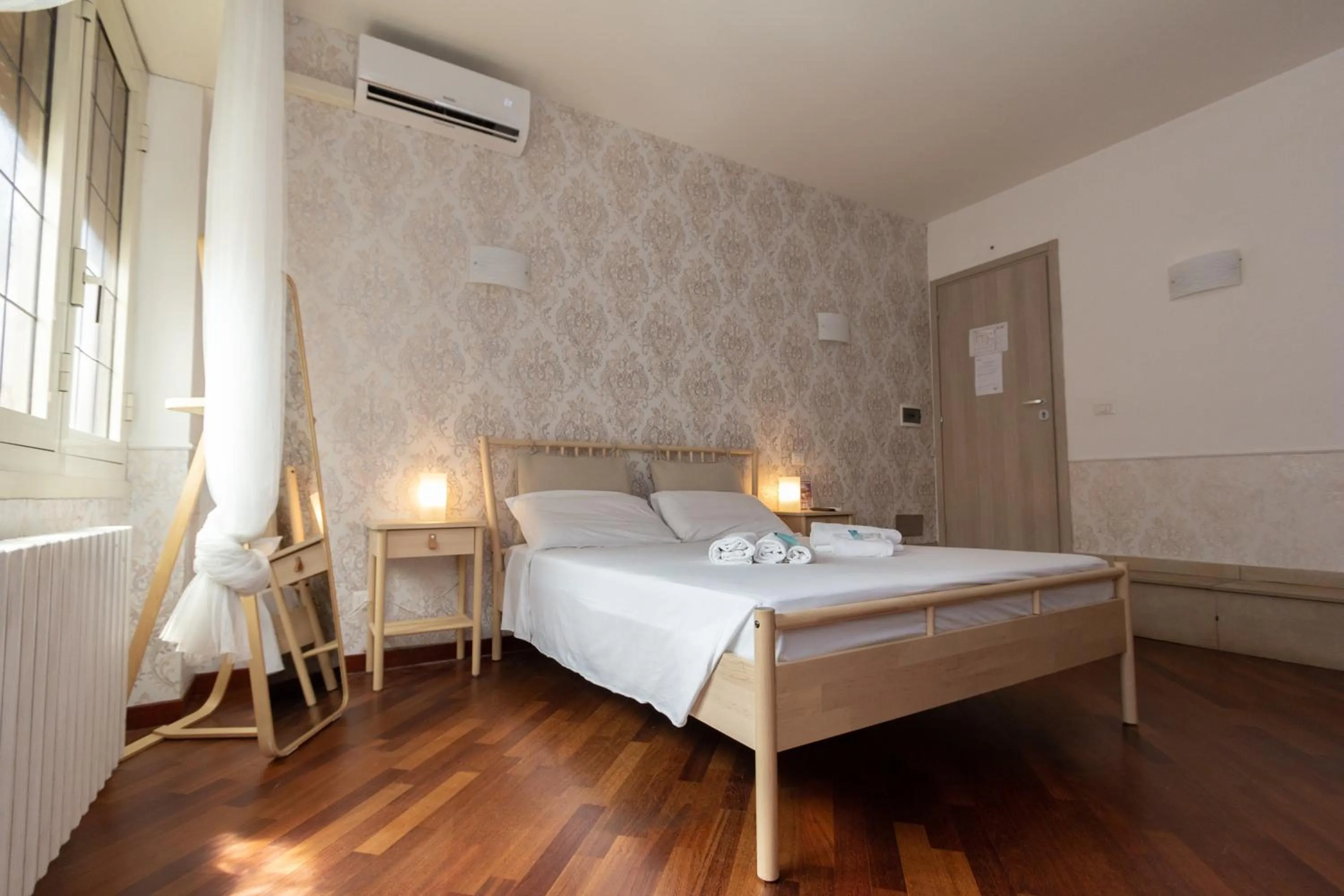 Bed in Aurelio Deluxe Rooms