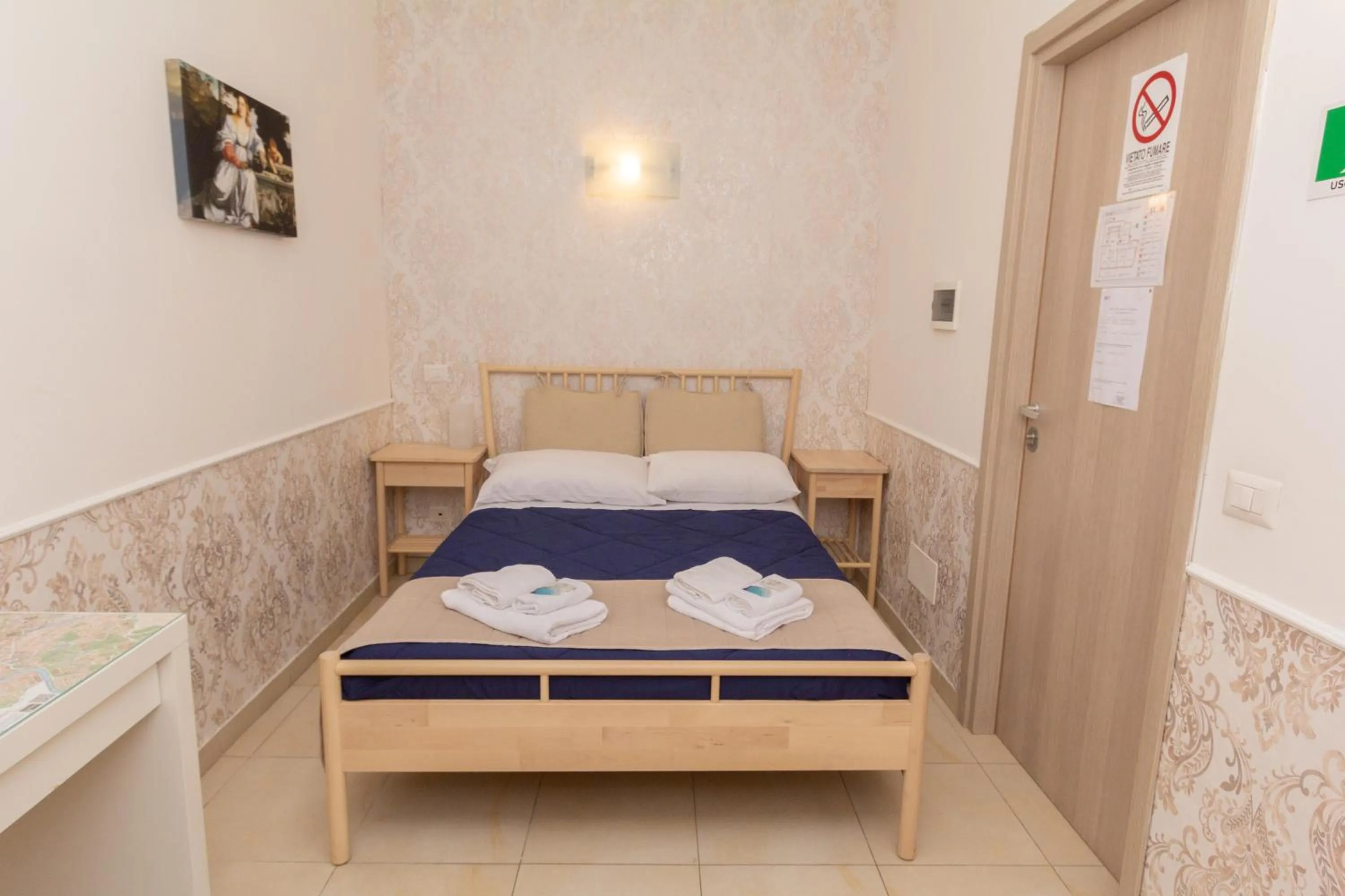 Bed in Aurelio Deluxe Rooms