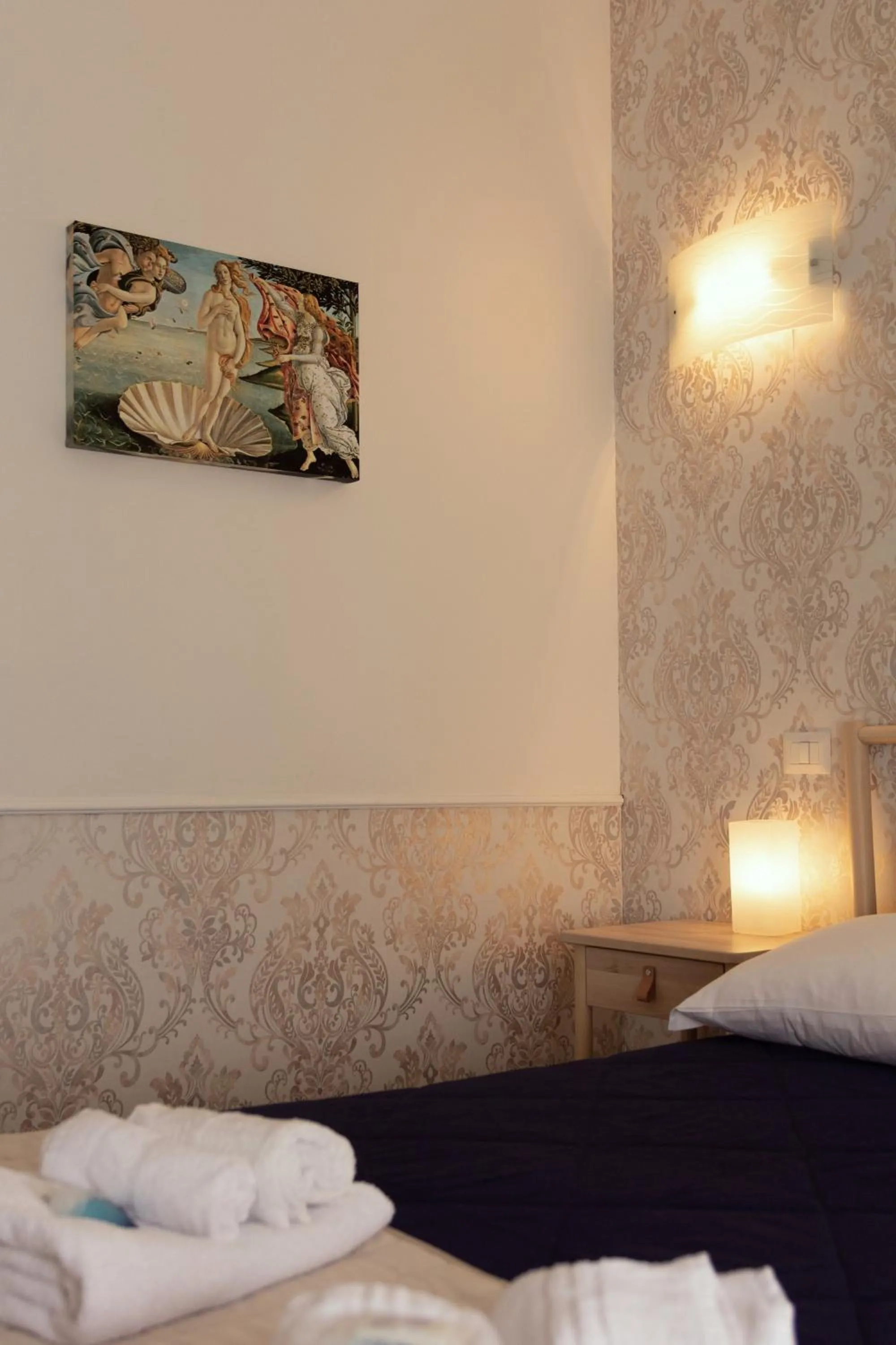 Decorative detail, Bed in Aurelio Deluxe Rooms