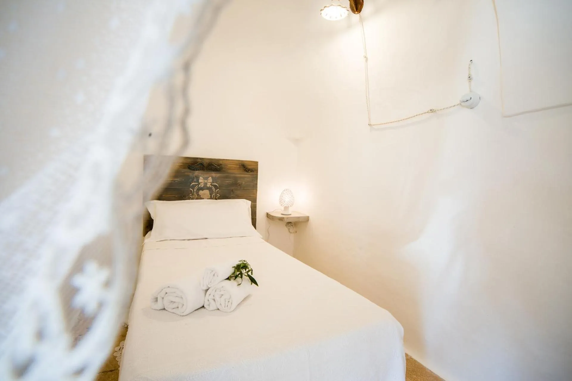 Bed in Trulli Nuova Aia Resort