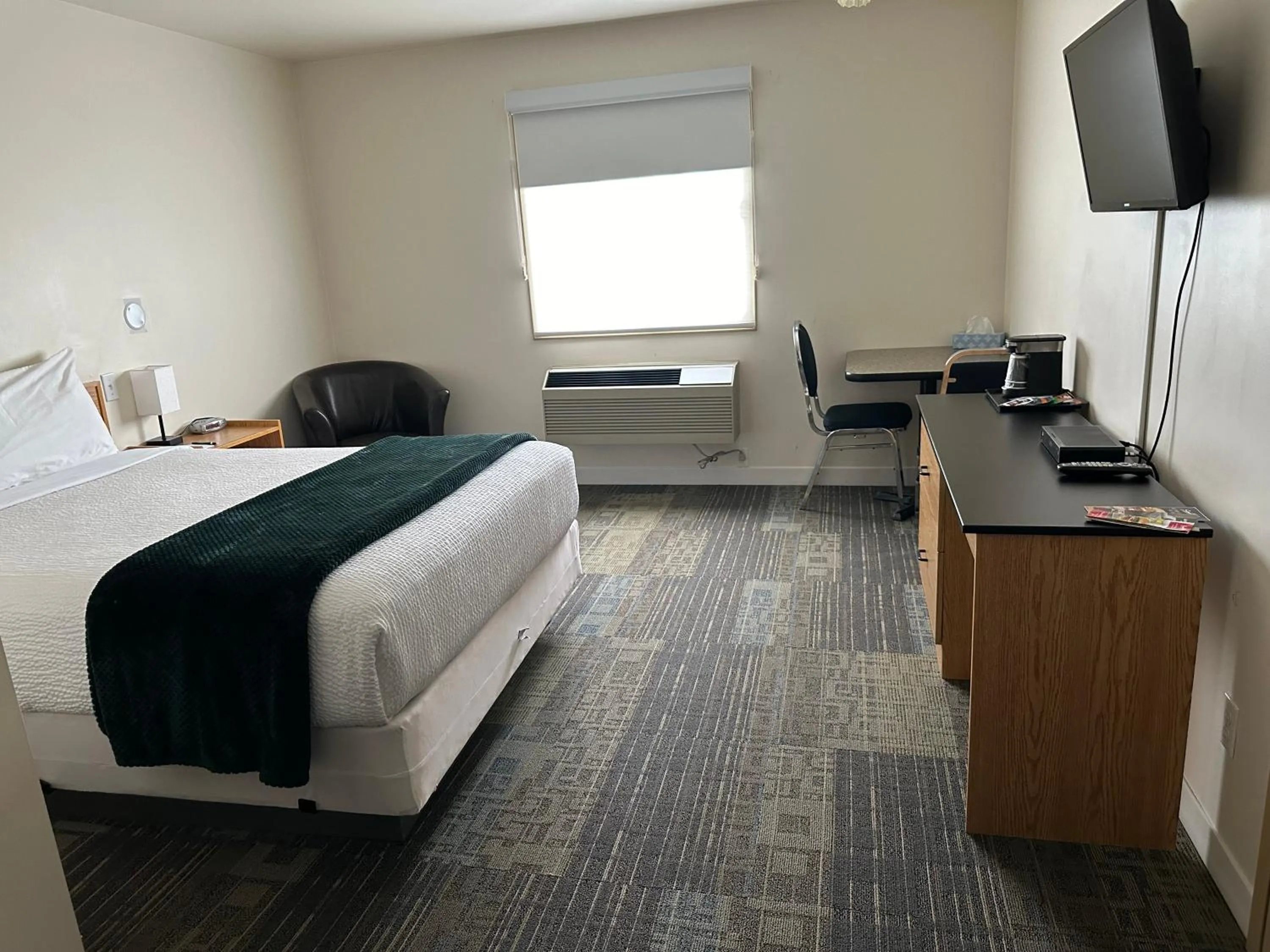 Bed in Sleep Suite Motel