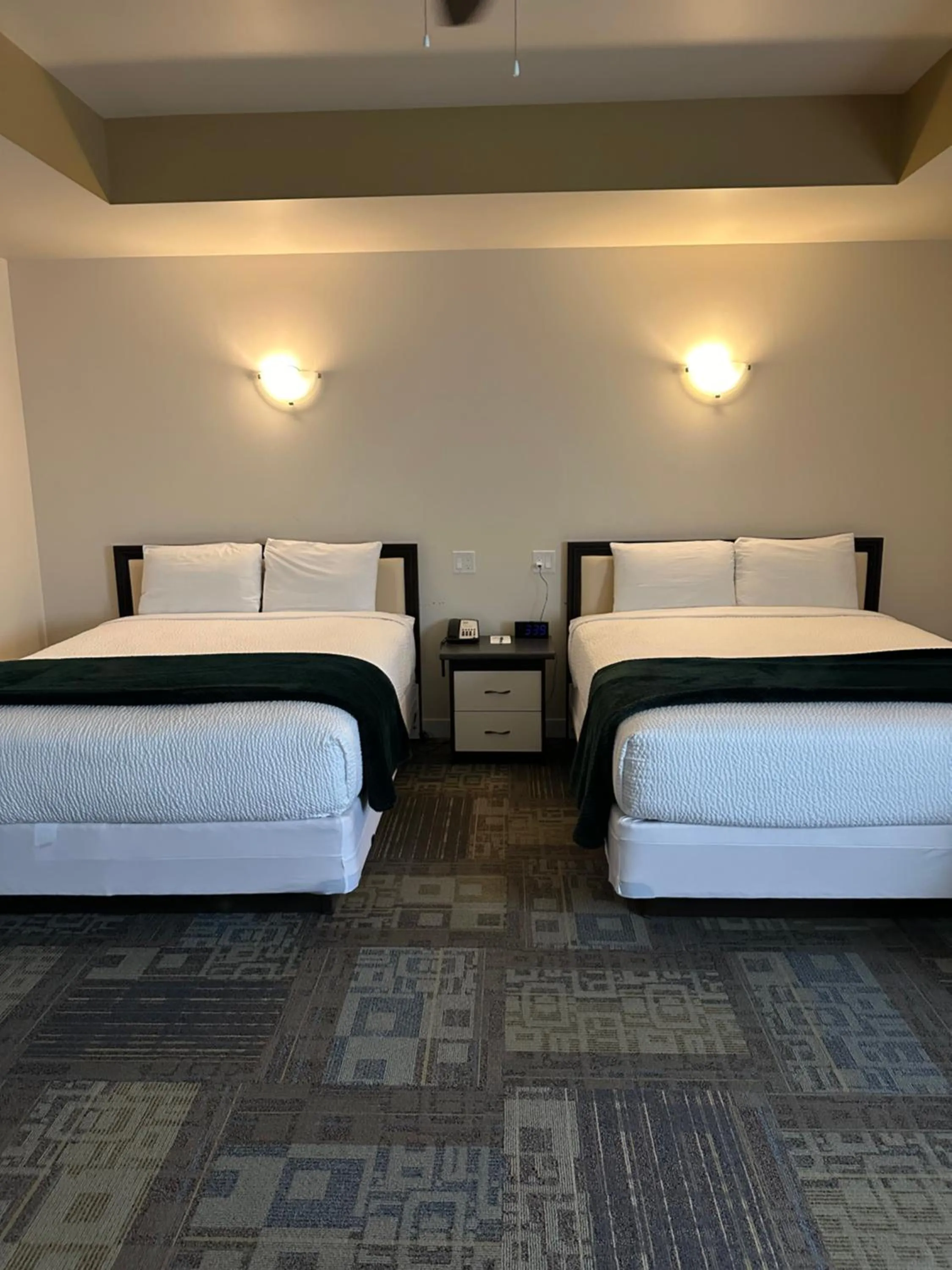 Bed in Sleep Suite Motel