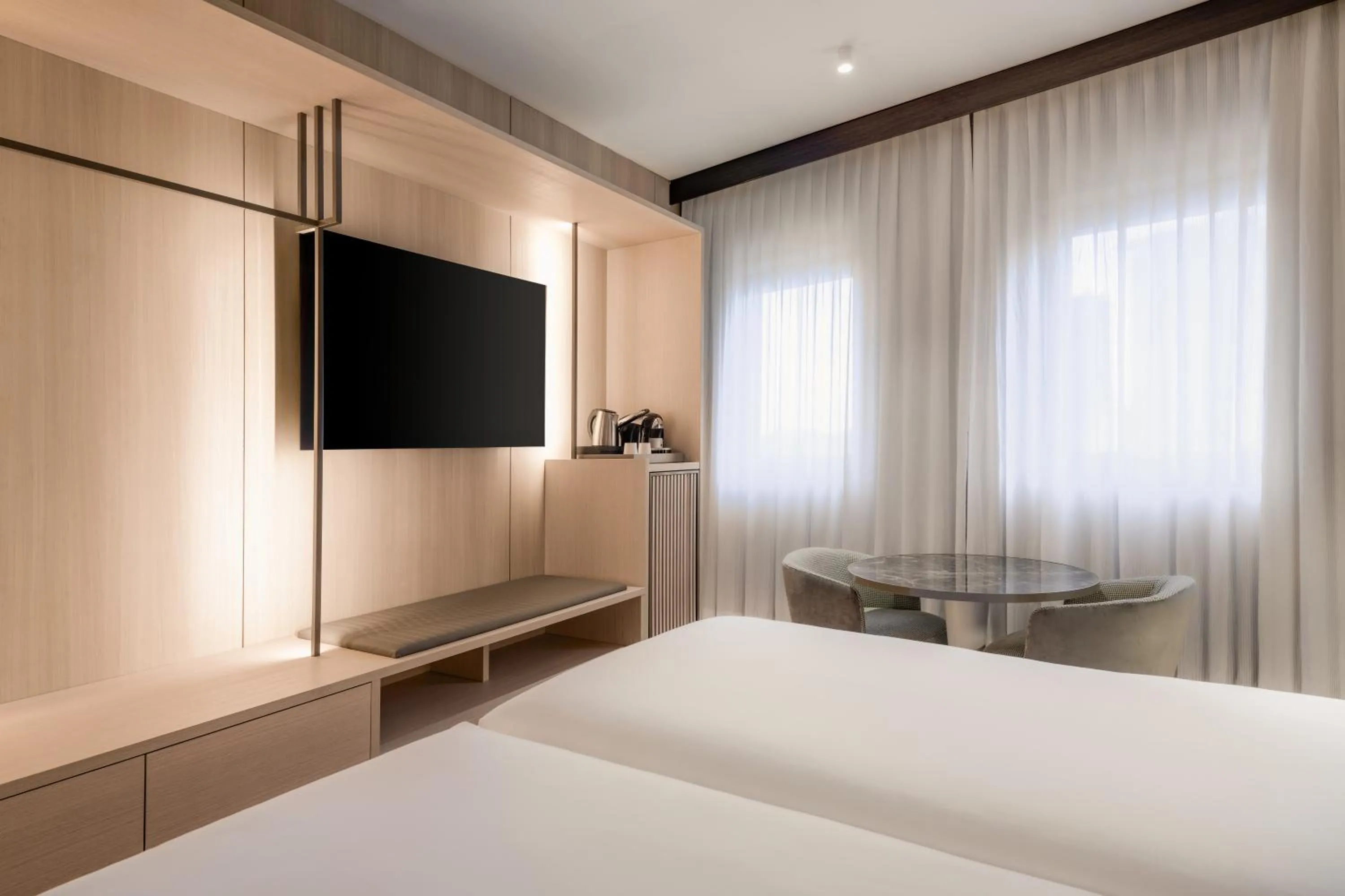 Bed in AC Hotel Milano by Marriott