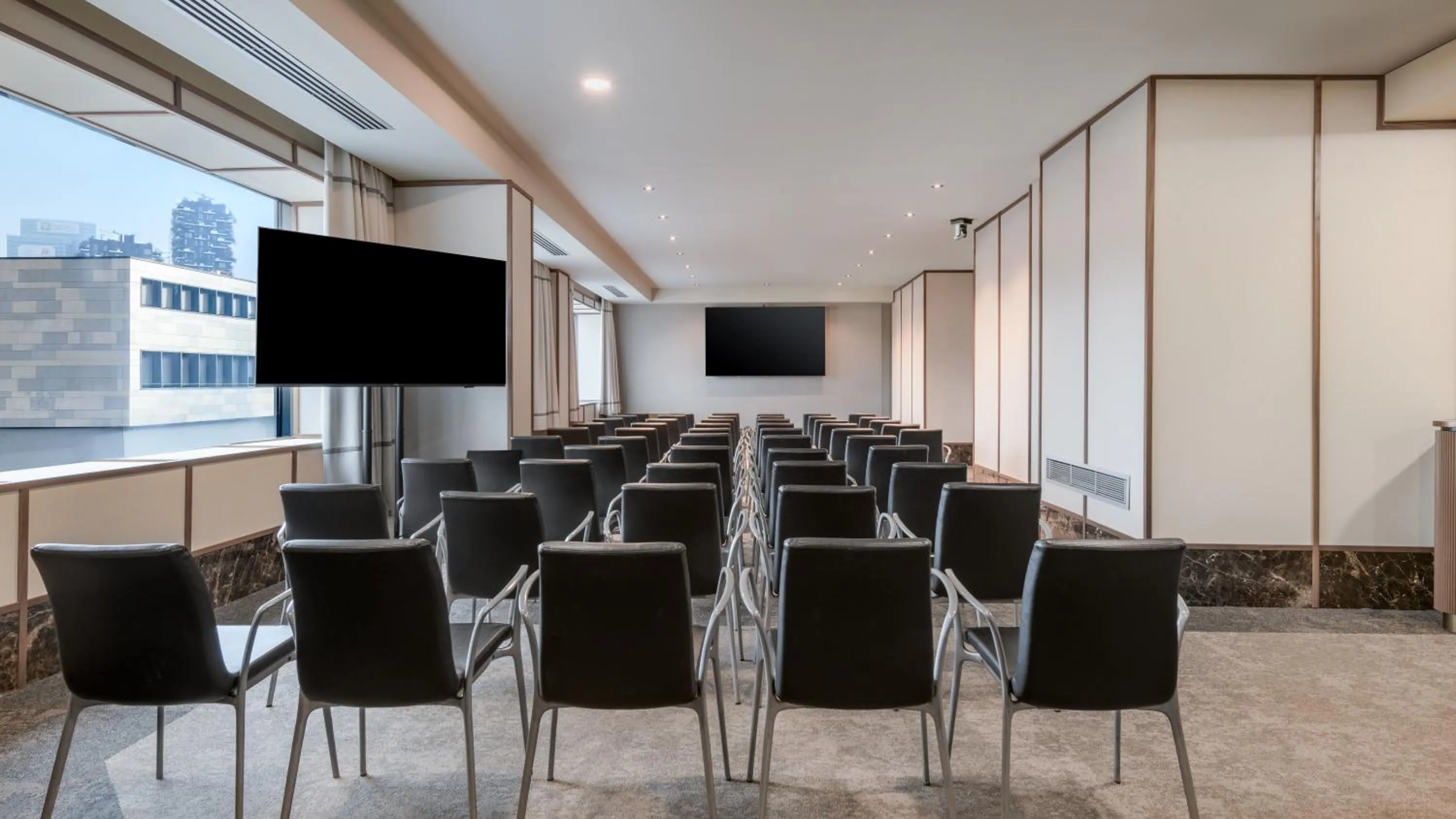 Communal lounge/ TV room in AC Hotel Milano by Marriott