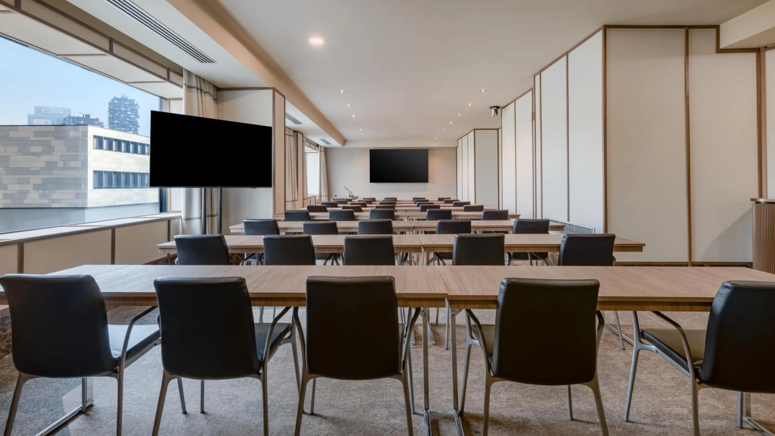 Communal lounge/ TV room in AC Hotel Milano by Marriott