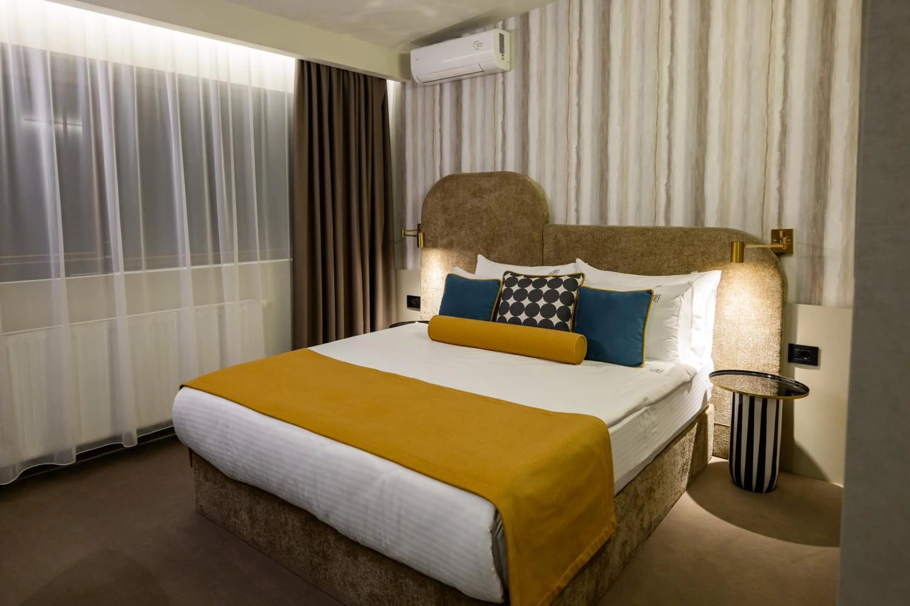 Bed in ArtLoft Garni Hotel