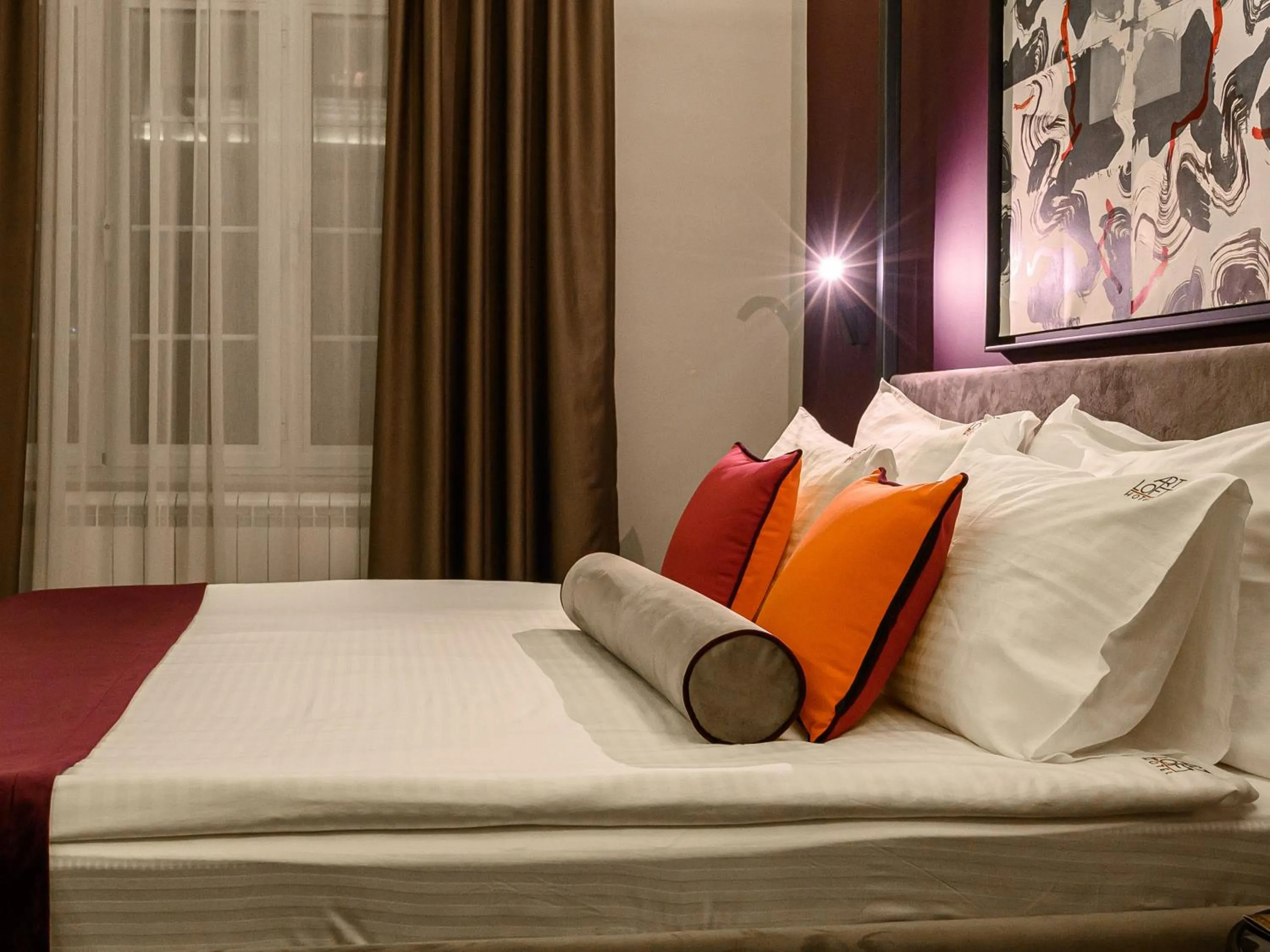 Bed in ArtLoft Garni Hotel