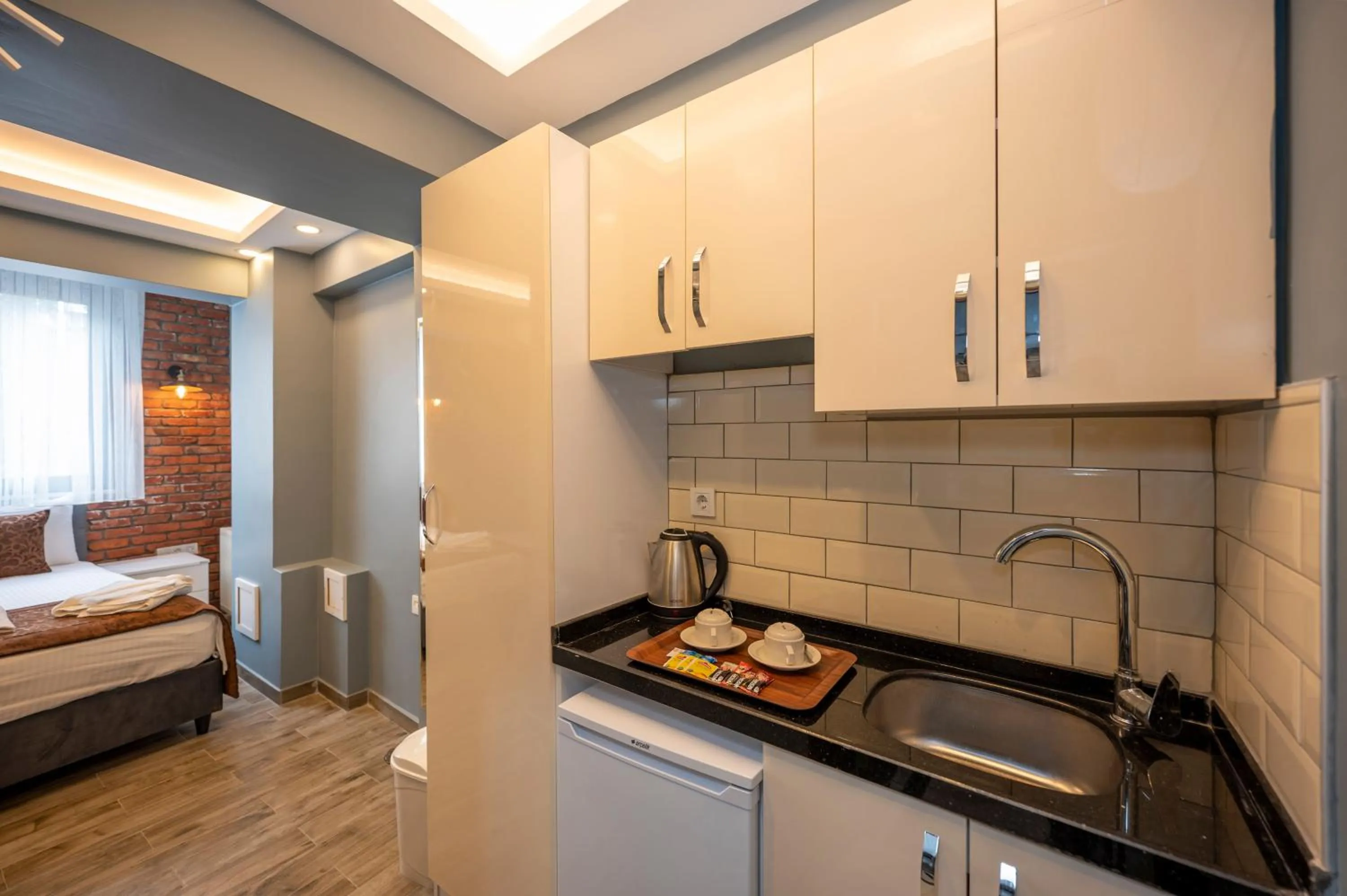 Kitchen or kitchenette, Bed in Taksim Story Residence