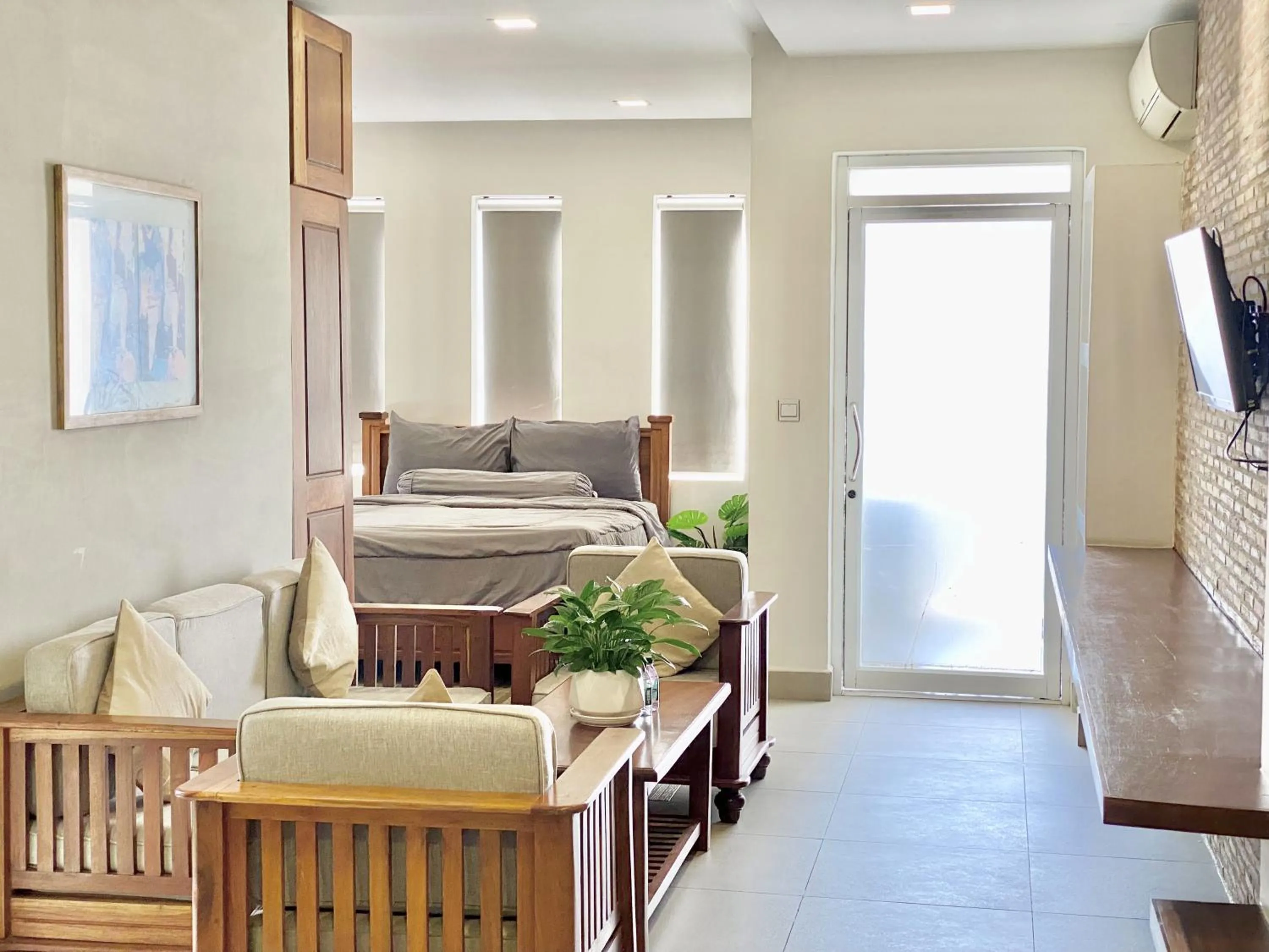 Seating area, Bed in WH Bassac Residence