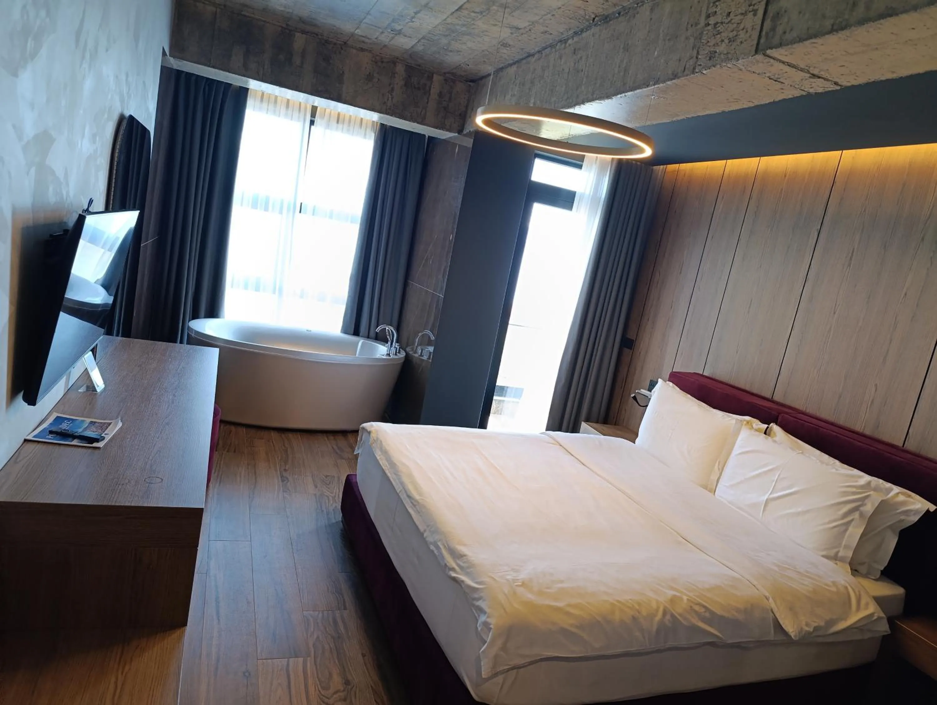 Communal lounge/ TV room, Bed in Toka Hotel Restaurant