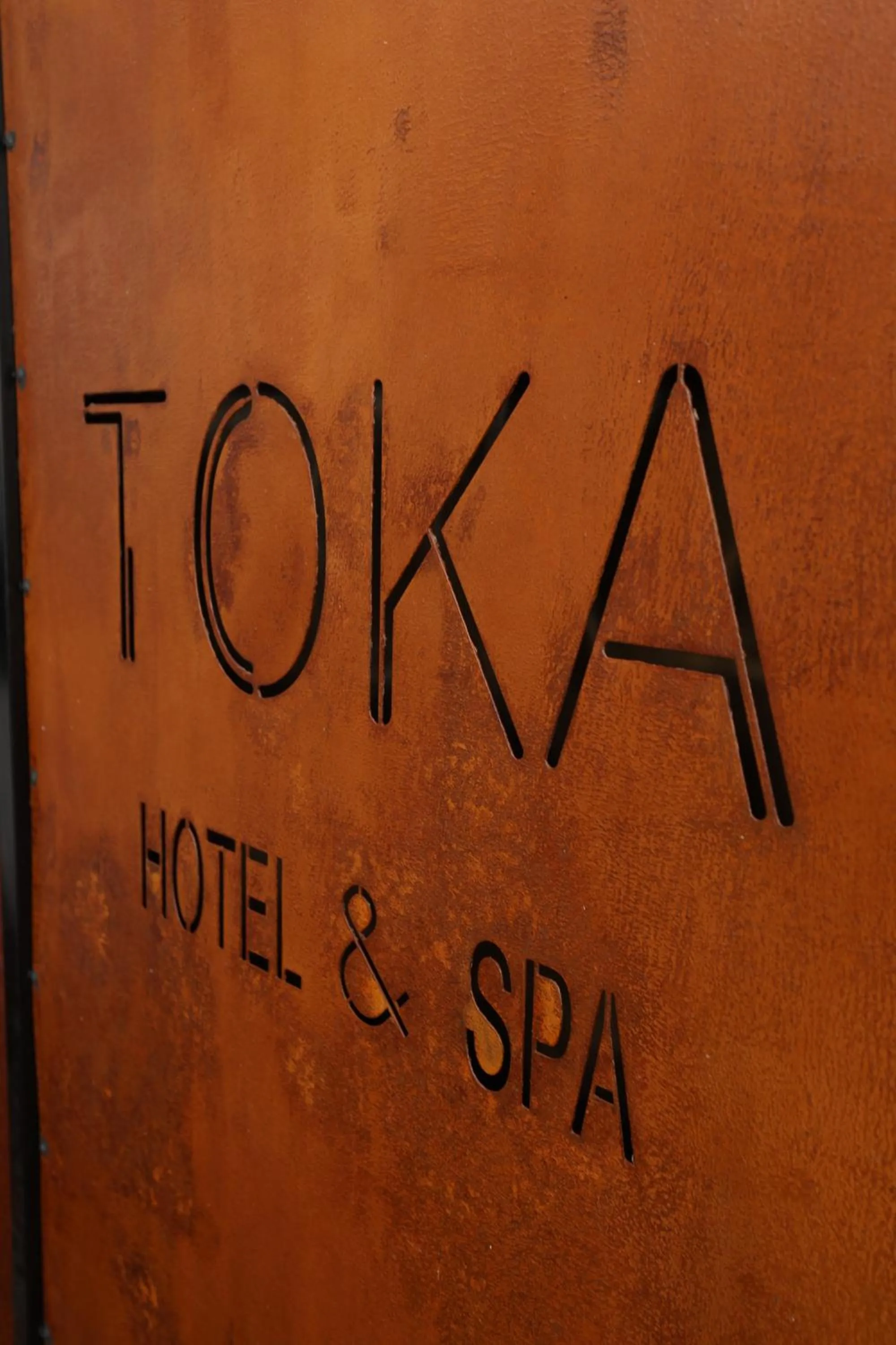 Property logo or sign in Toka Hotel Restaurant