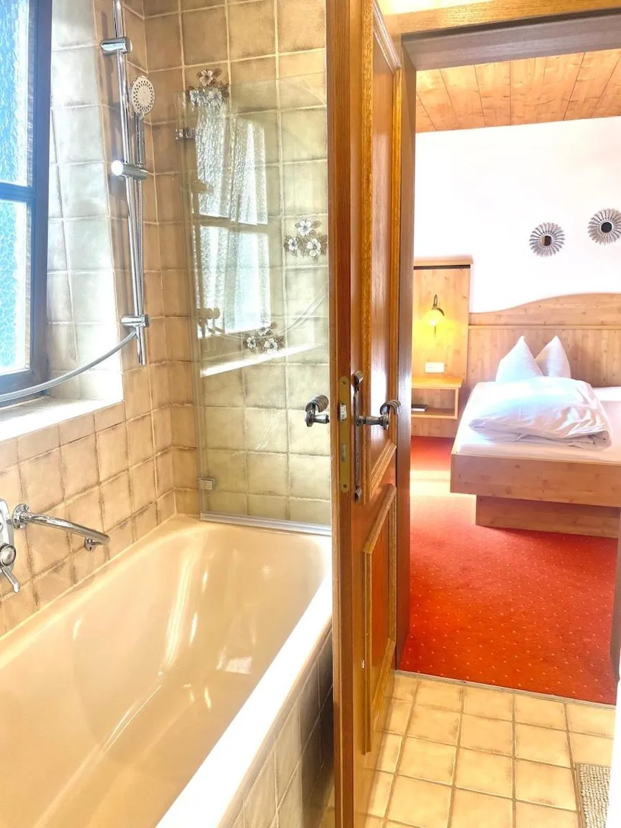 Bed in Das Maximilian - Feines Landhotel am Schliersee