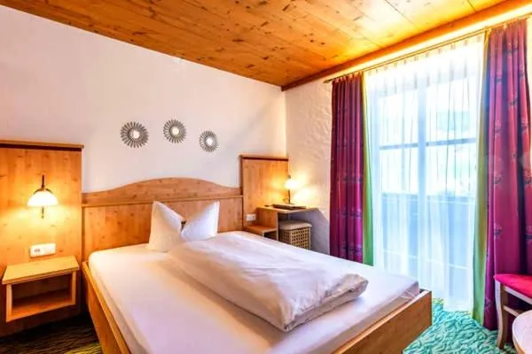 Bed in Das Maximilian - Feines Landhotel am Schliersee