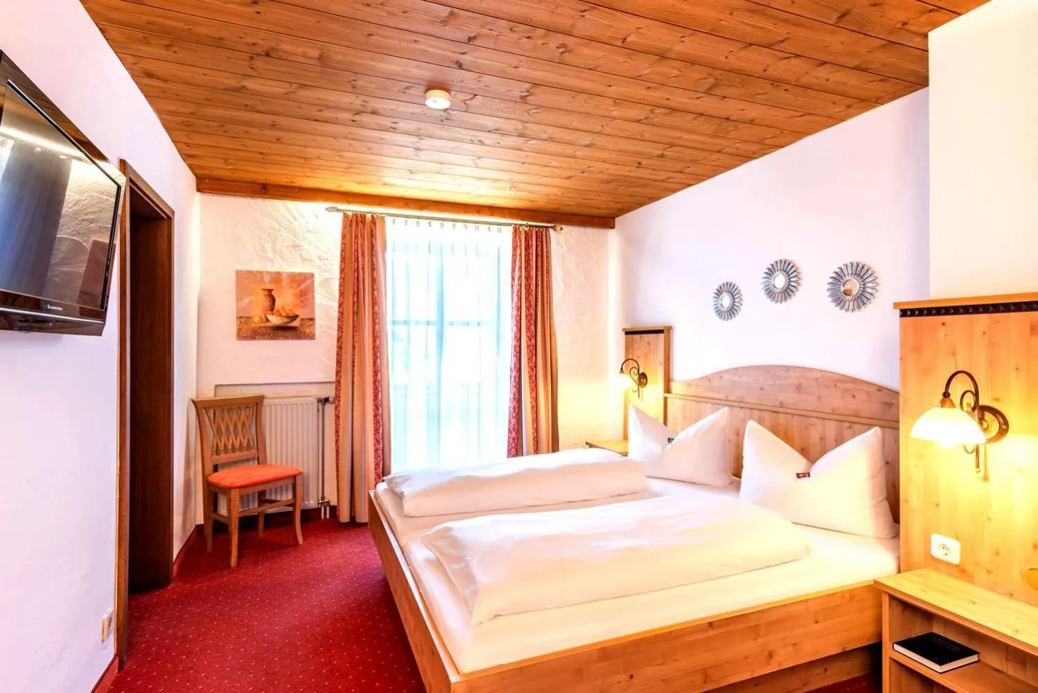 Bed in Das Maximilian - Feines Landhotel am Schliersee
