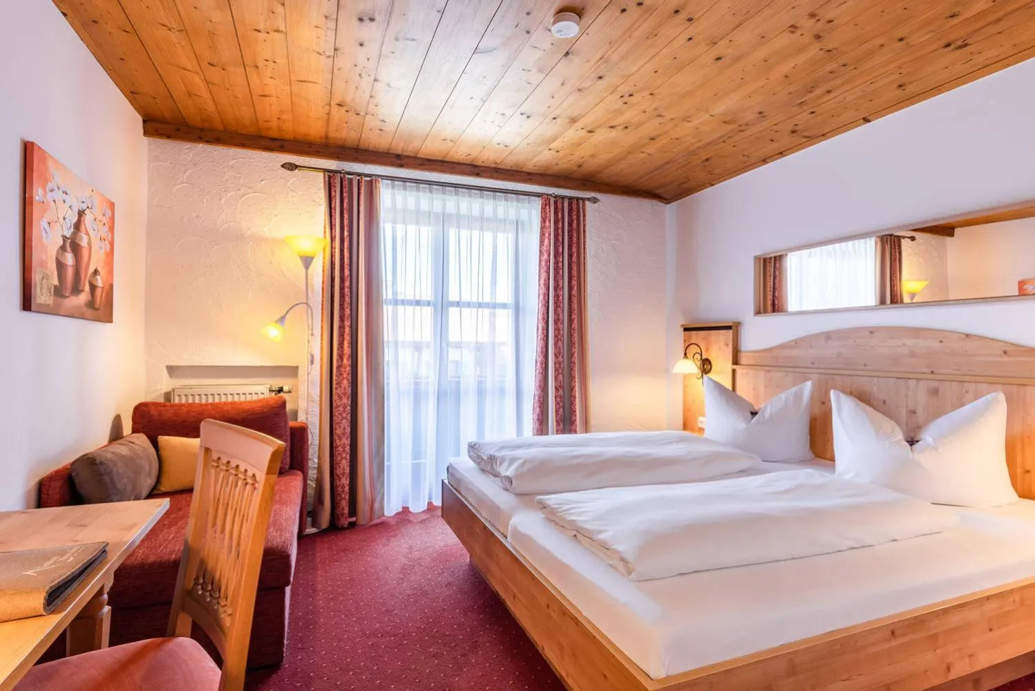 Bed in Das Maximilian - Feines Landhotel am Schliersee
