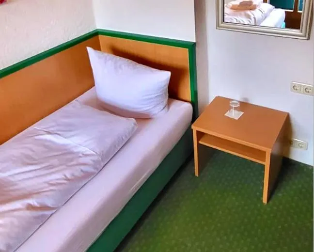 Bed in Das Maximilian - Feines Landhotel am Schliersee