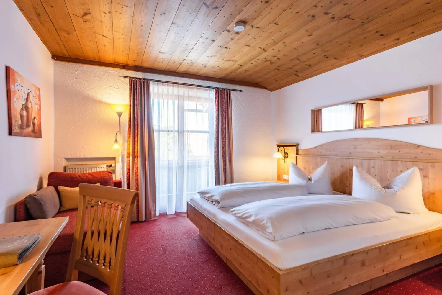 Bed in Das Maximilian - Feines Landhotel am Schliersee