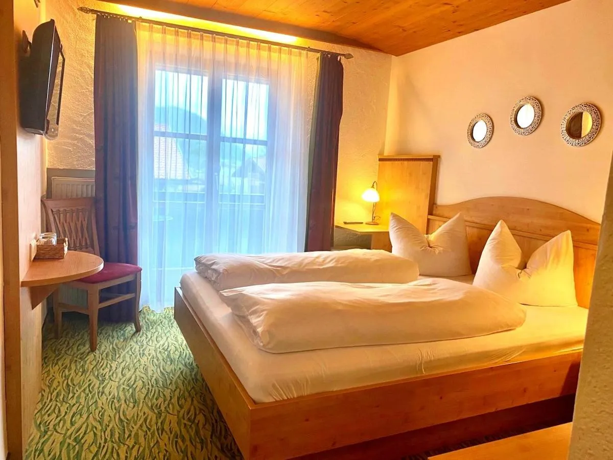 Bed in Das Maximilian - Feines Landhotel am Schliersee