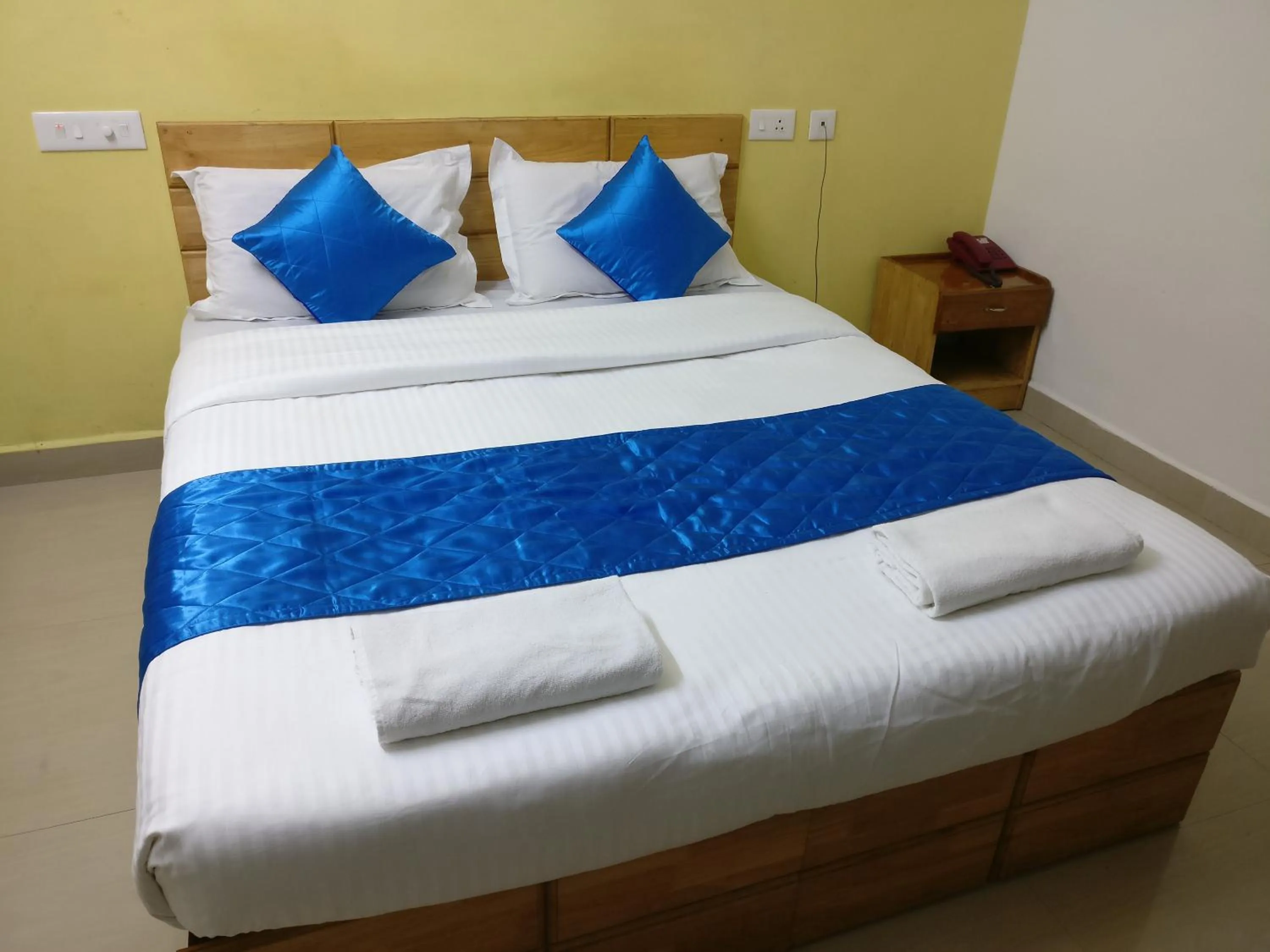 Photo of the whole room, Bed in A V Residency