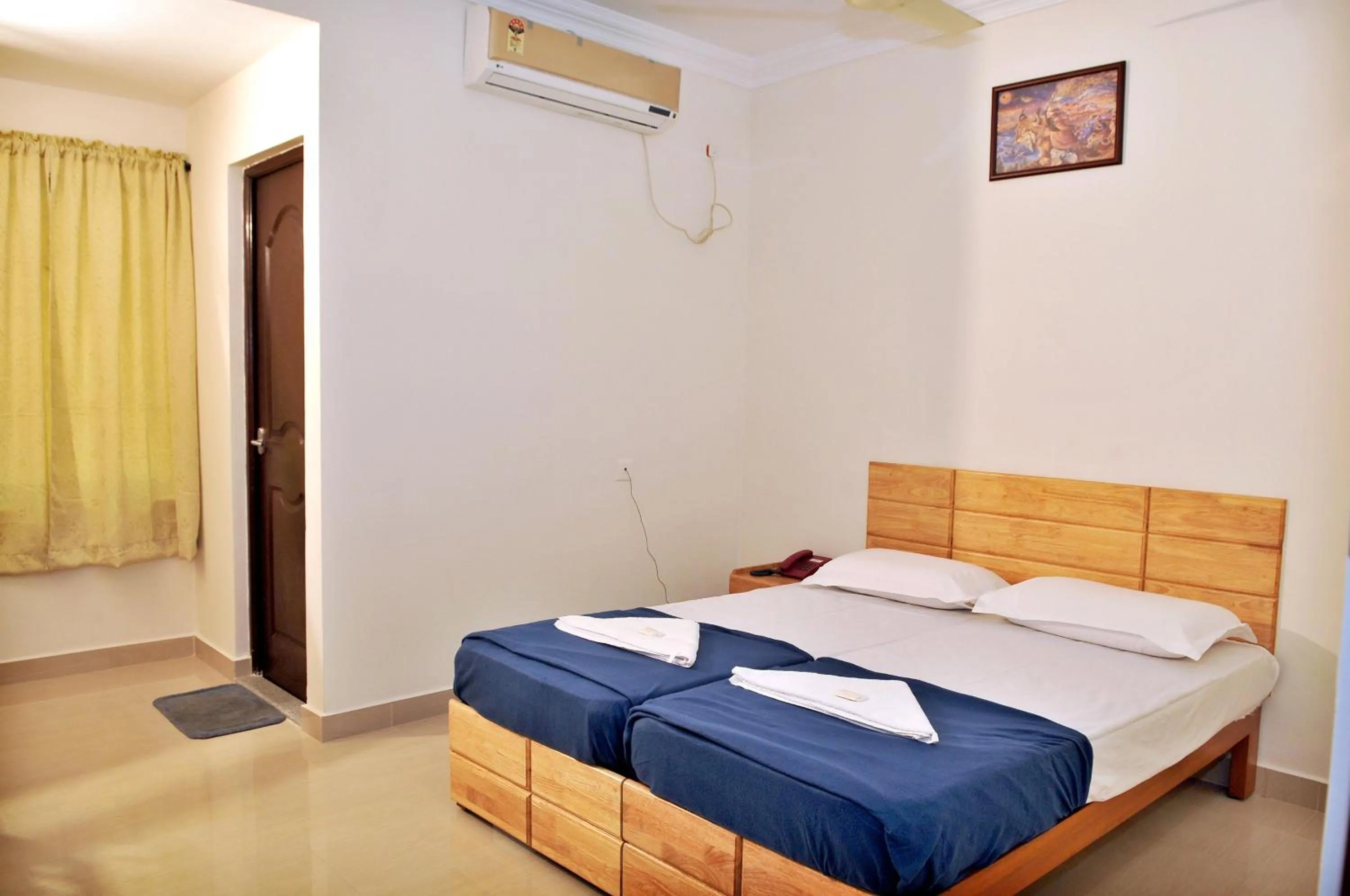 Bed in A V Residency