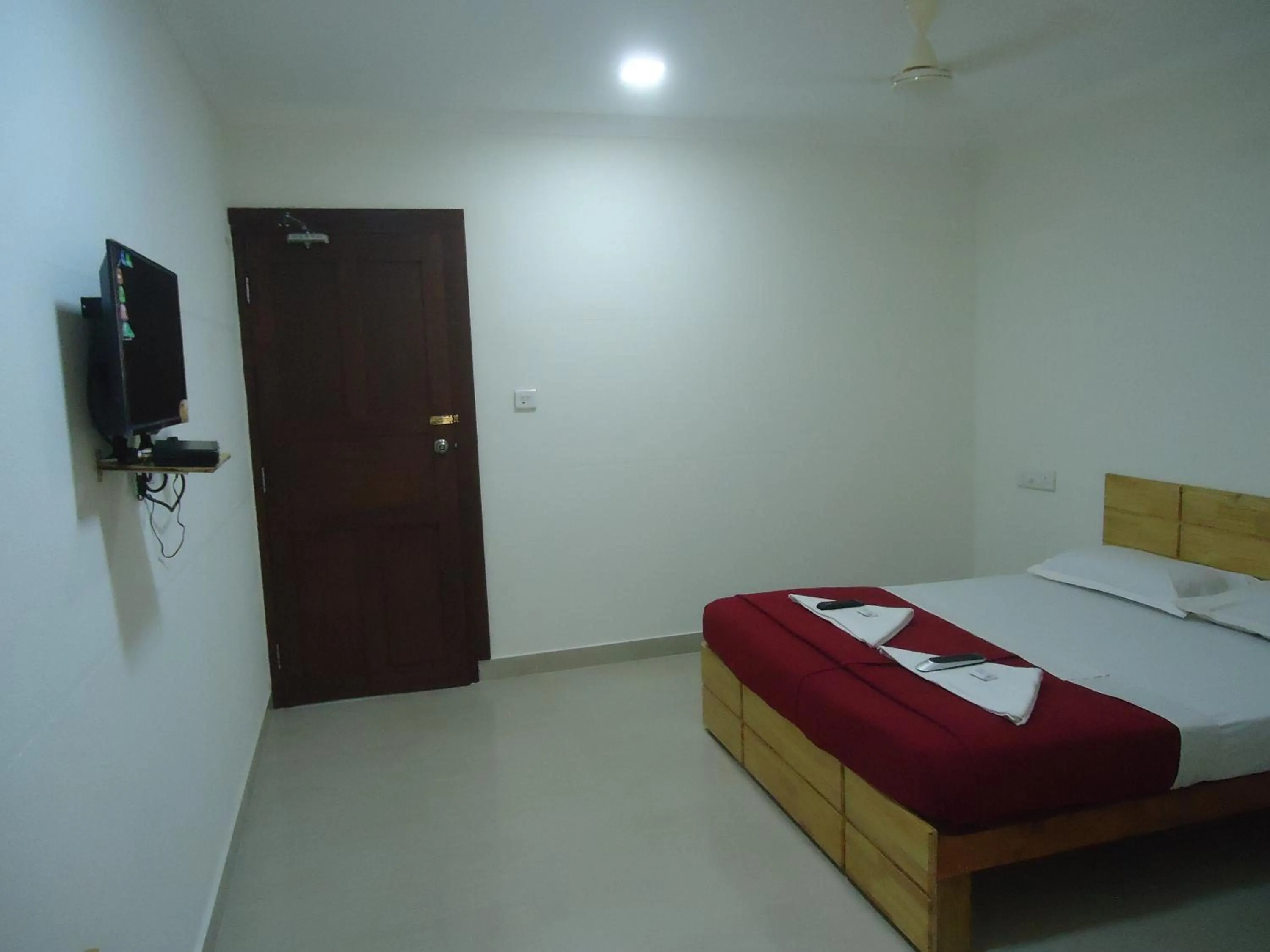 Photo of the whole room, Bed in A V Residency