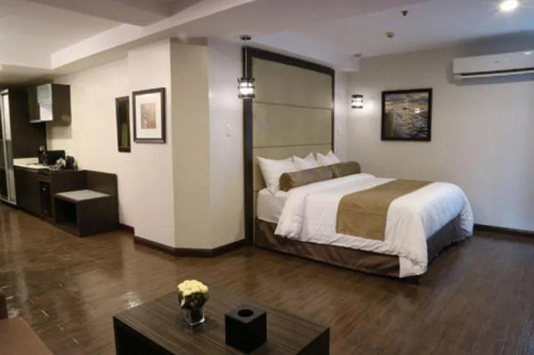 Bed in My Happy Place West Avenue Suites