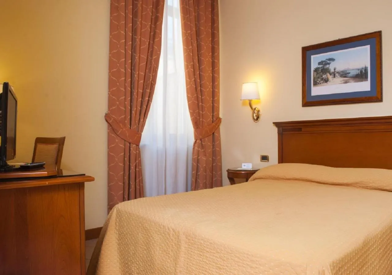 Bed in Le Cheminée Business Hotel Napoli