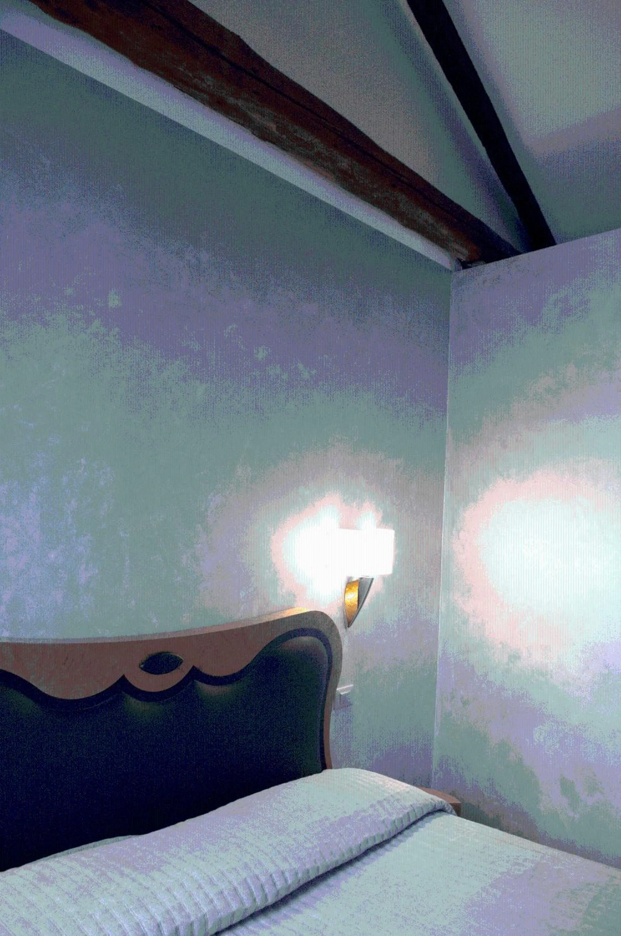 Bed in Hotel Paganelli