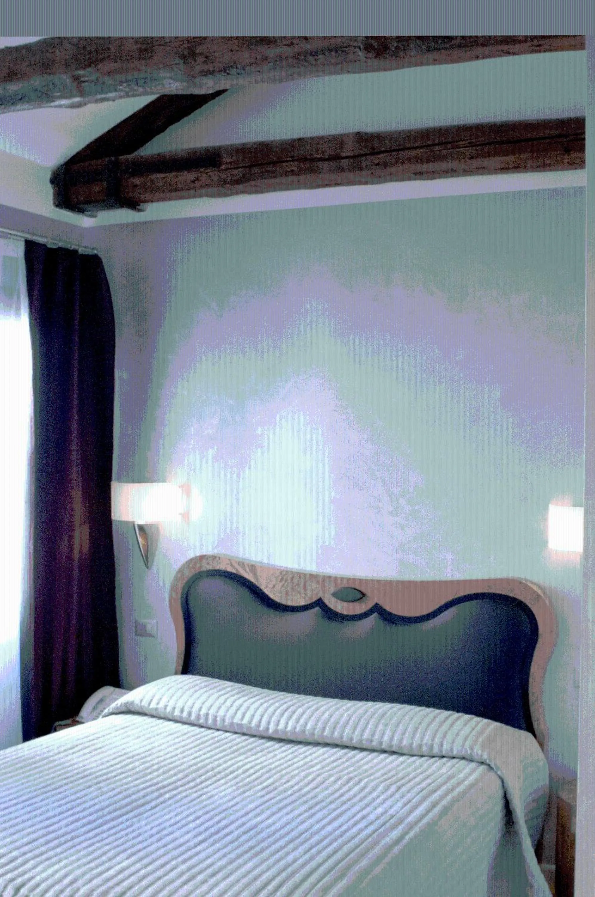 Bed in Hotel Paganelli