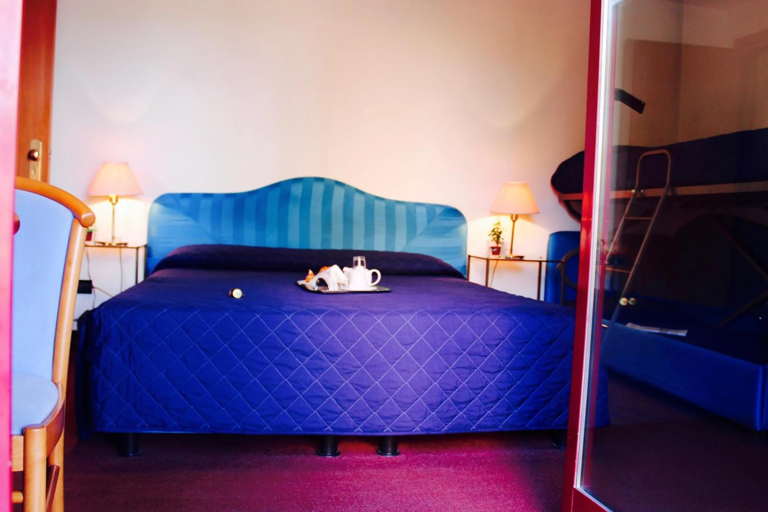 Bed in Arcangelo Roof Hotel