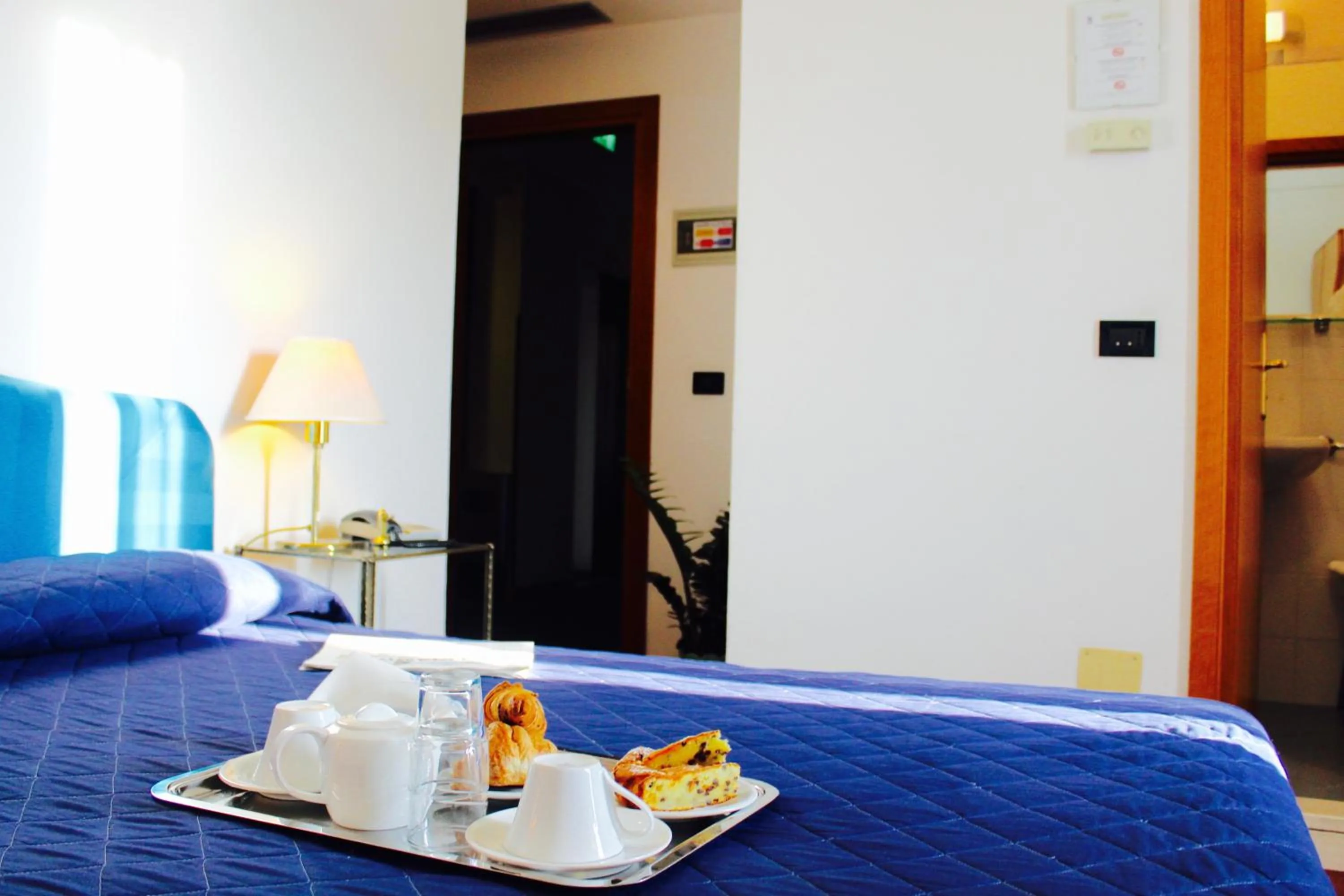 Bed in Arcangelo Roof Hotel