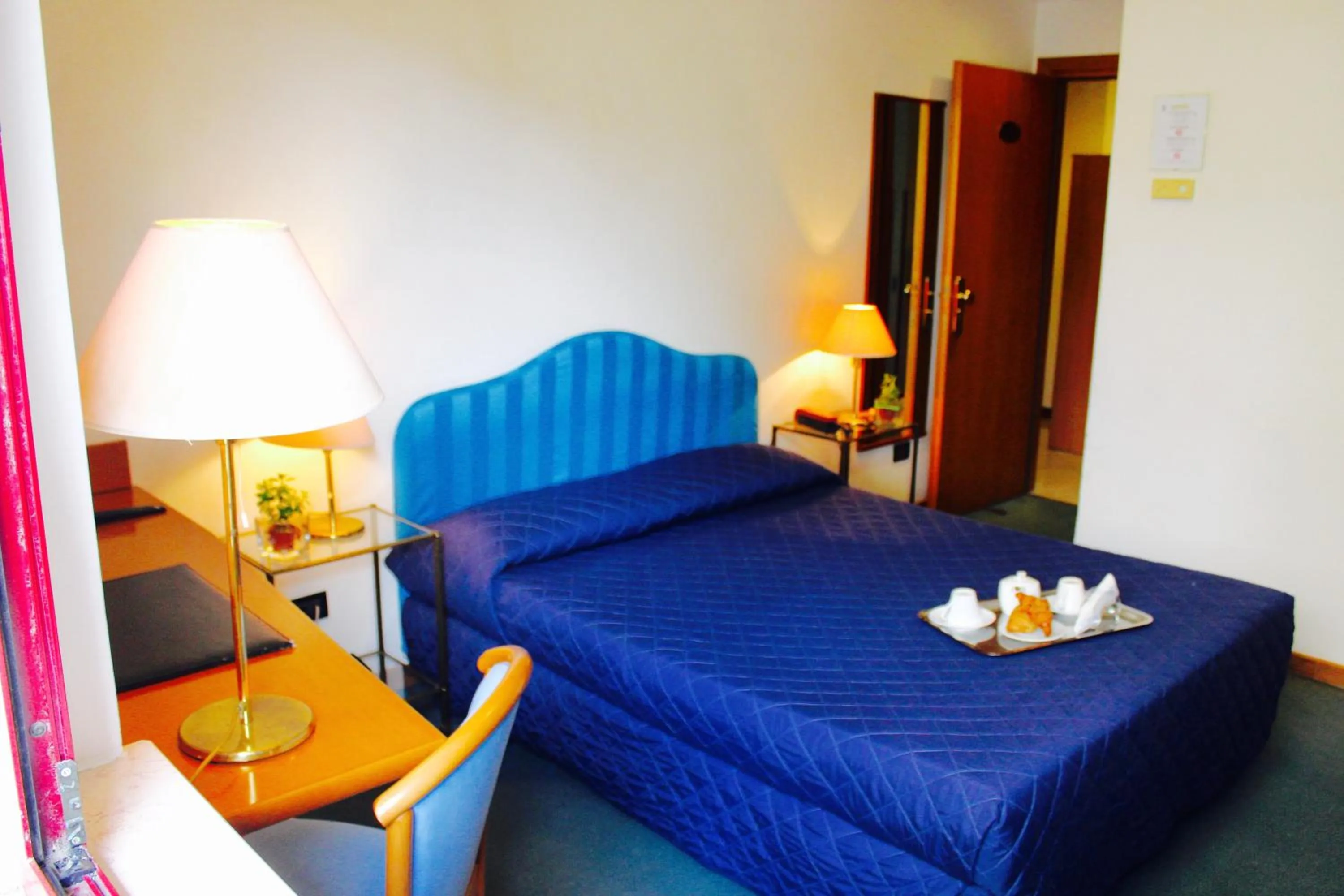 Bed in Arcangelo Roof Hotel